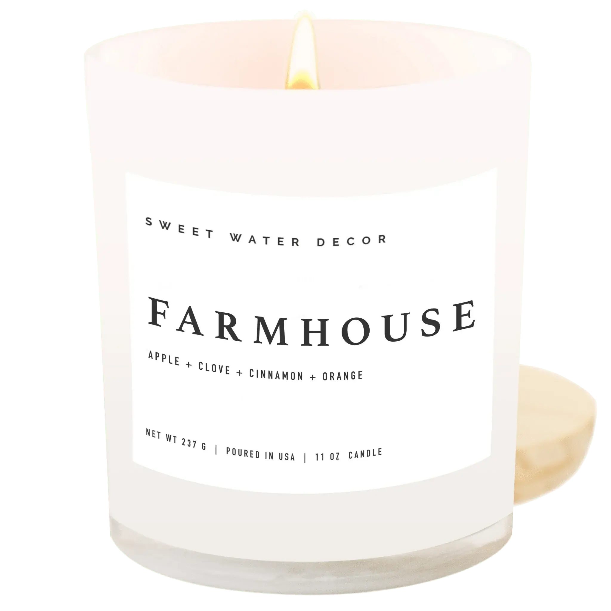 Farmhouse scented candle with apple, clove, cinnamon, orange notes in frosted glass jar, cozy home decor
