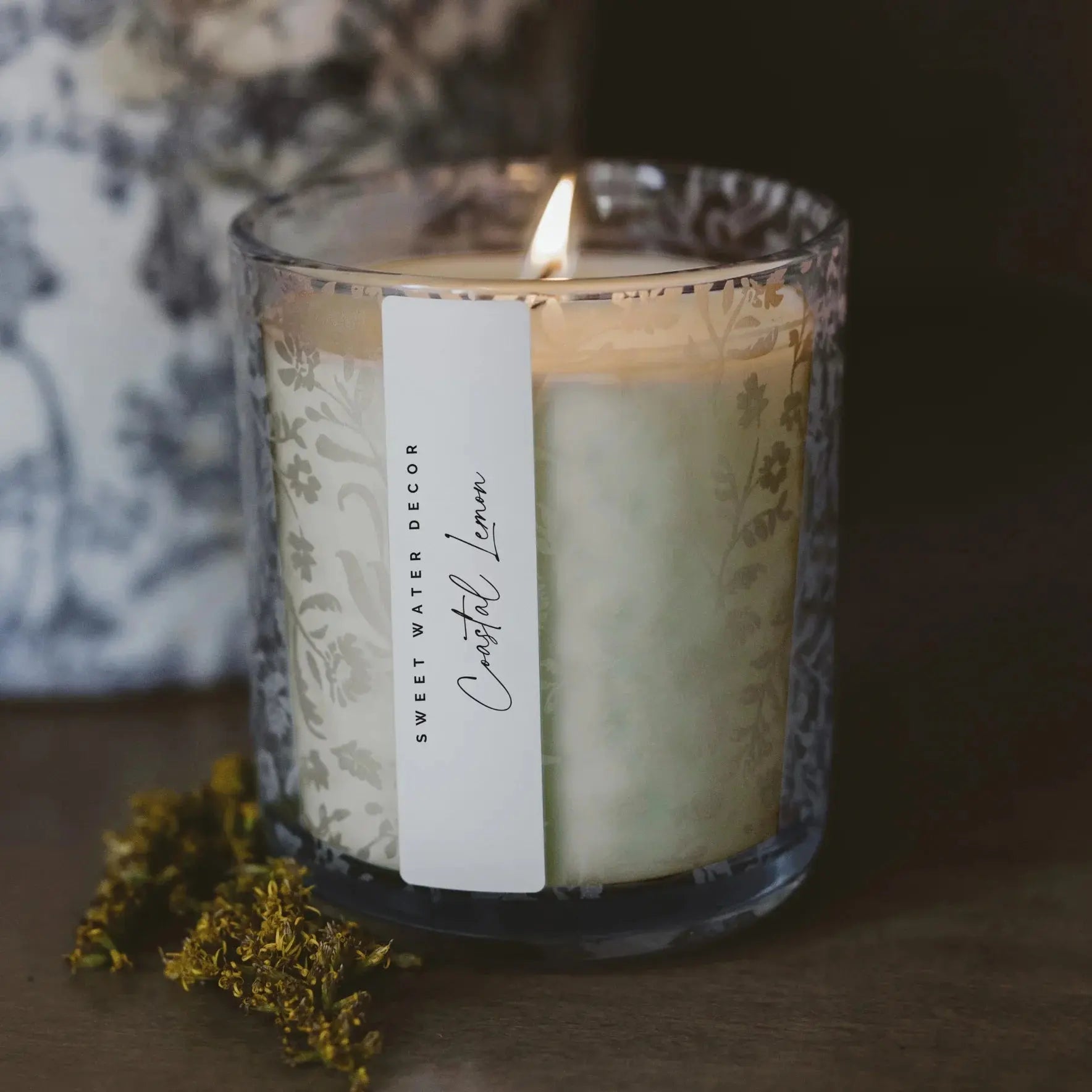 Coastal Lemon scented candle in floral glass jar, cozy farmhouse decor with dried flowers