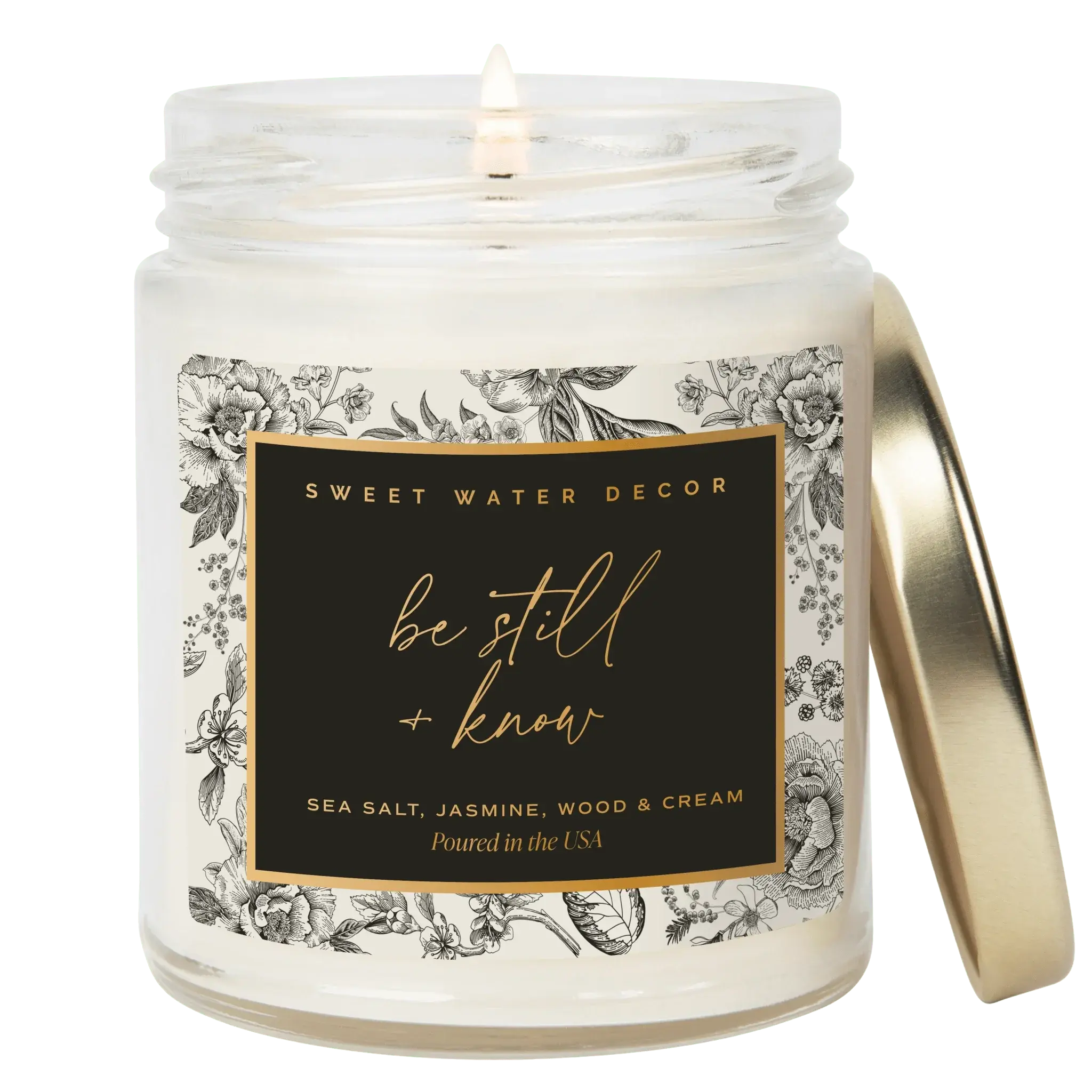 Be Still & Know scented candle with floral label, sea salt jasmine wood cream, cozy farmhouse decor