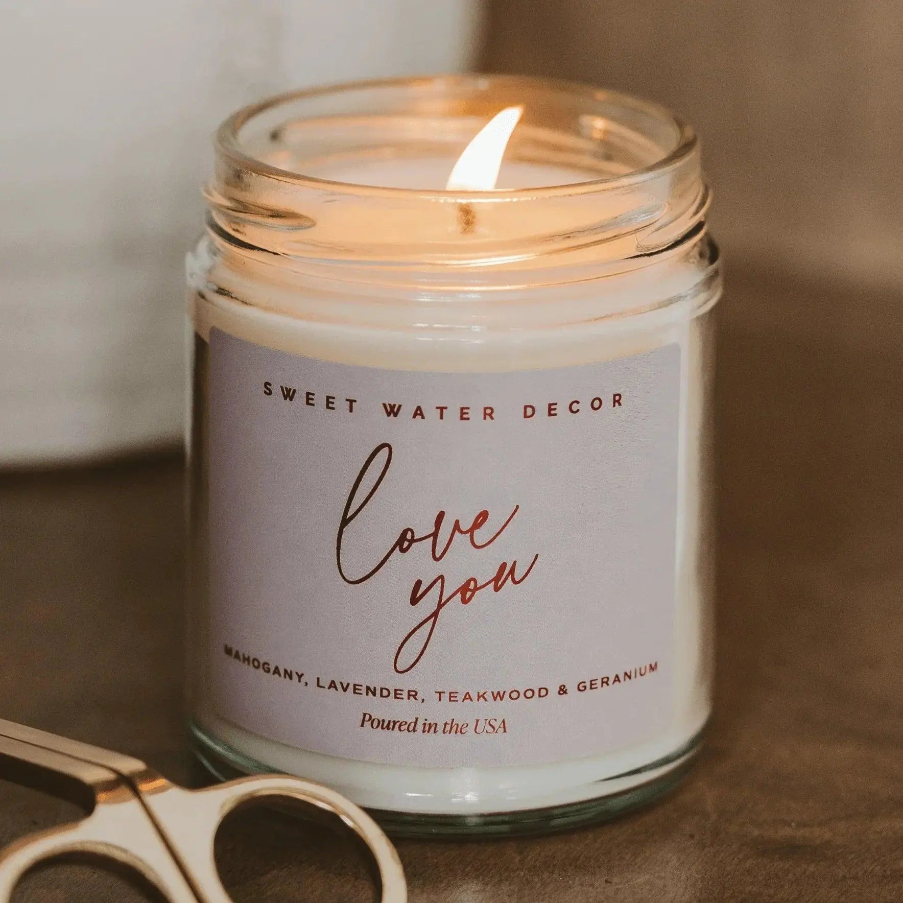 Lit 'Love You' soy candle in glass jar, farmhouse decor with lavender & teakwood scent, USA poured