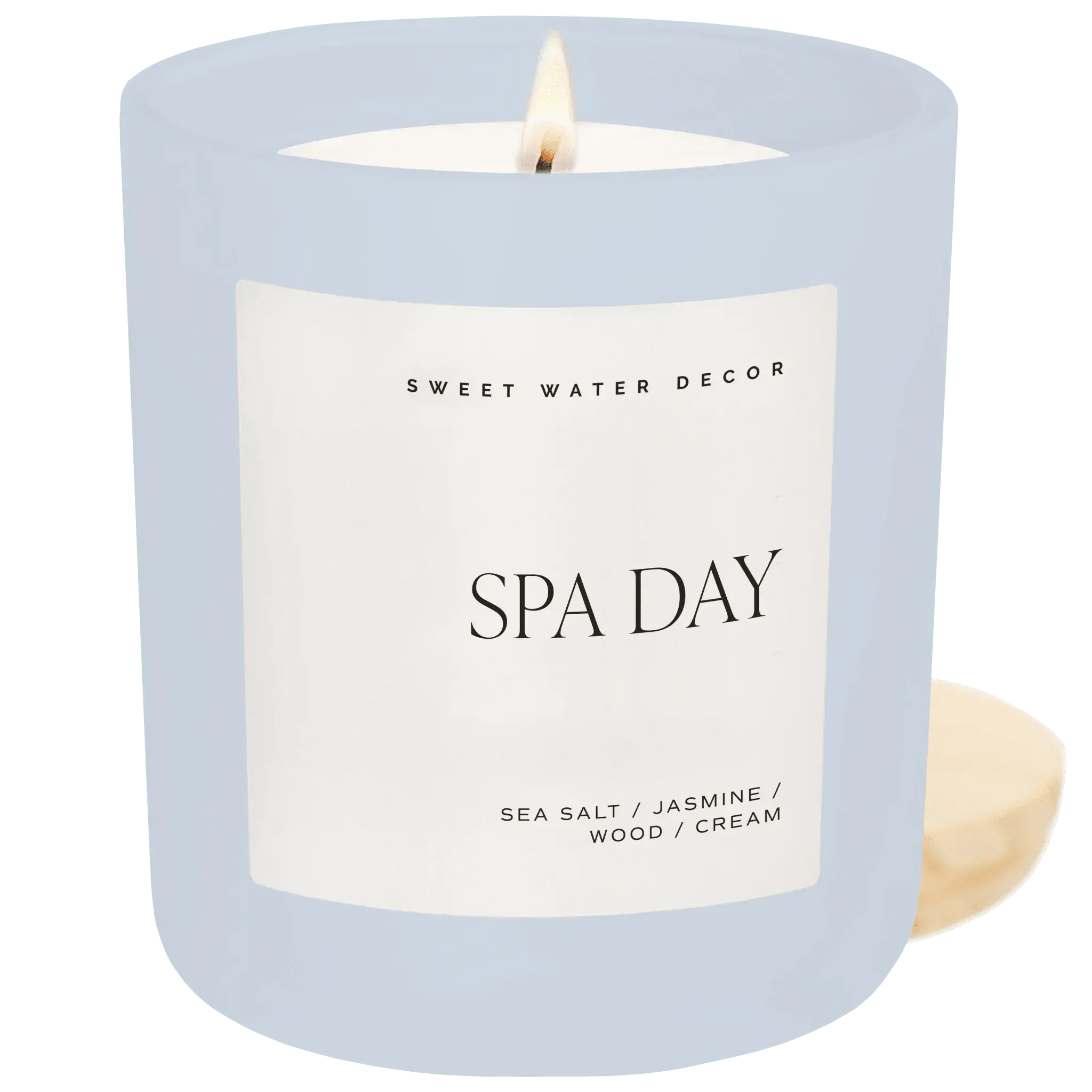 Lit Spa Day scented candle in frosted glass with wooden lid, featuring sea salt, jasmine, wood, cream notes for cozy home decor