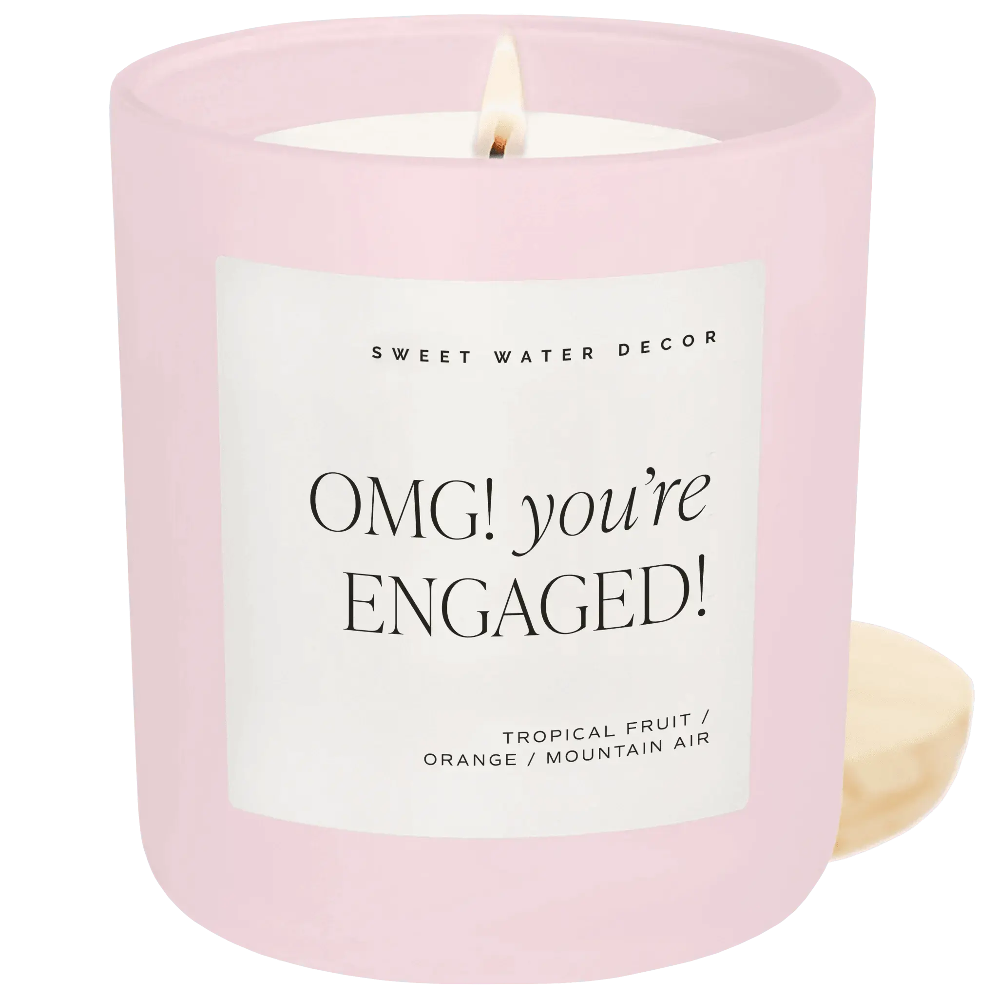 Pink engagement candle with 'OMG you're ENGAGED!' label, tropical fruit scent, cozy home decor