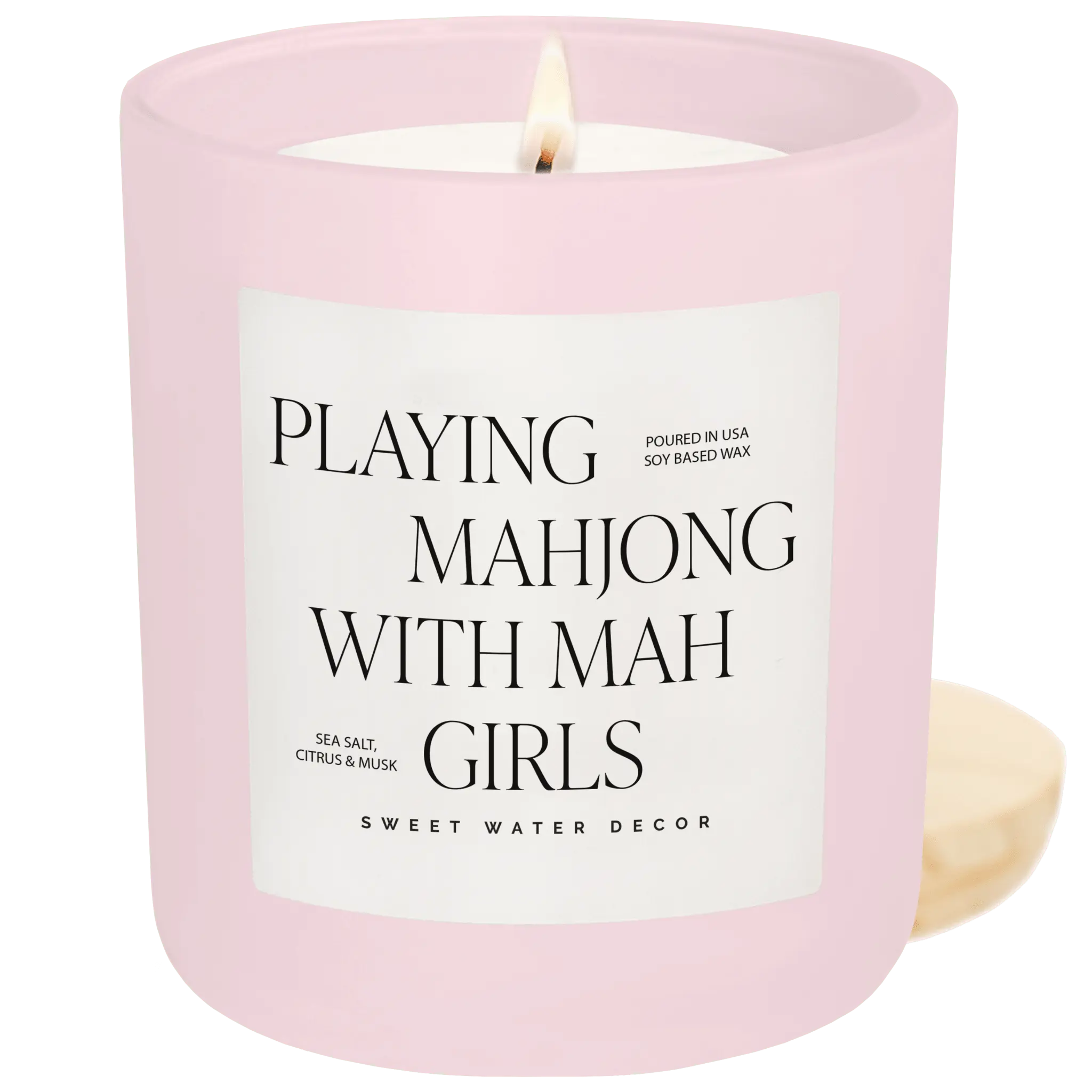 Pink candle with a label reading 'Playing Mahjong with Mah Girls' on a green background