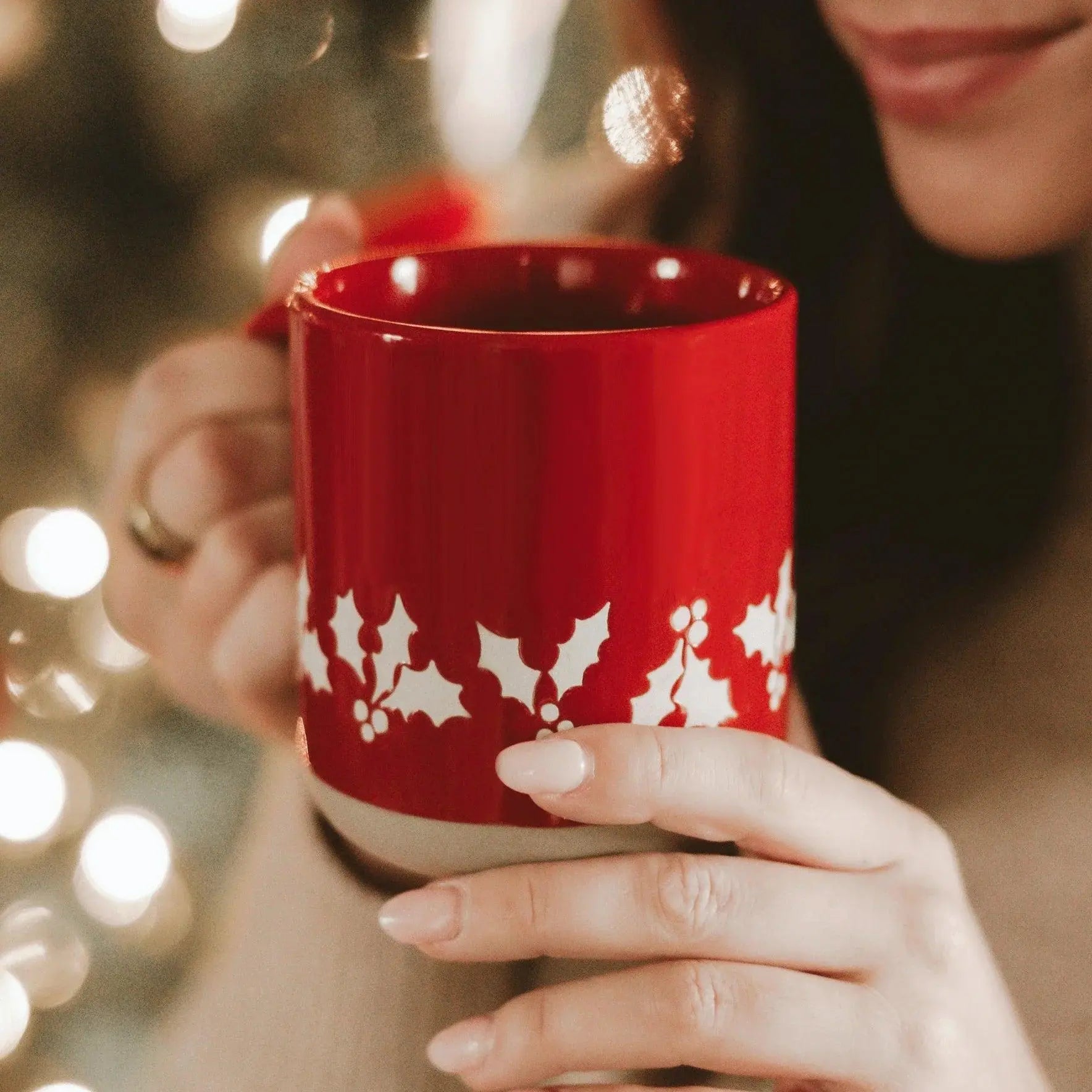 Red holiday mug with white holly design, cozy farmhouse style, perfect for winter drinks and festive decor