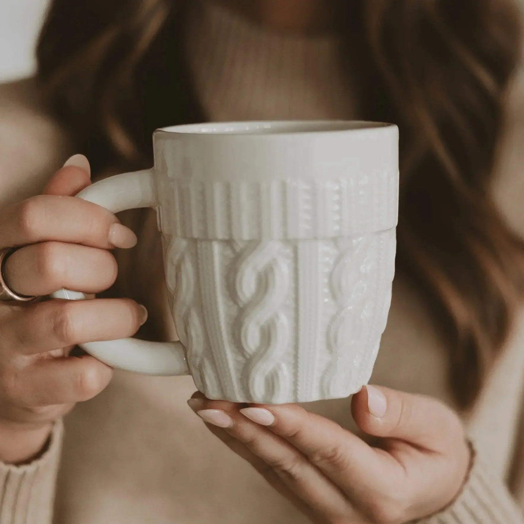 Cozy white ceramic mug with cable knit texture, perfect for farmhouse or cottage style home decor