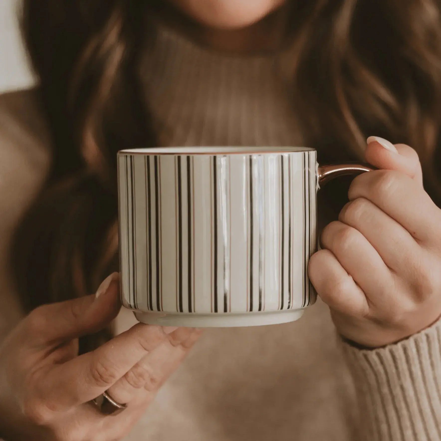 Cozy striped ceramic mug with gold handle, perfect for farmhouse or cottage style home decor