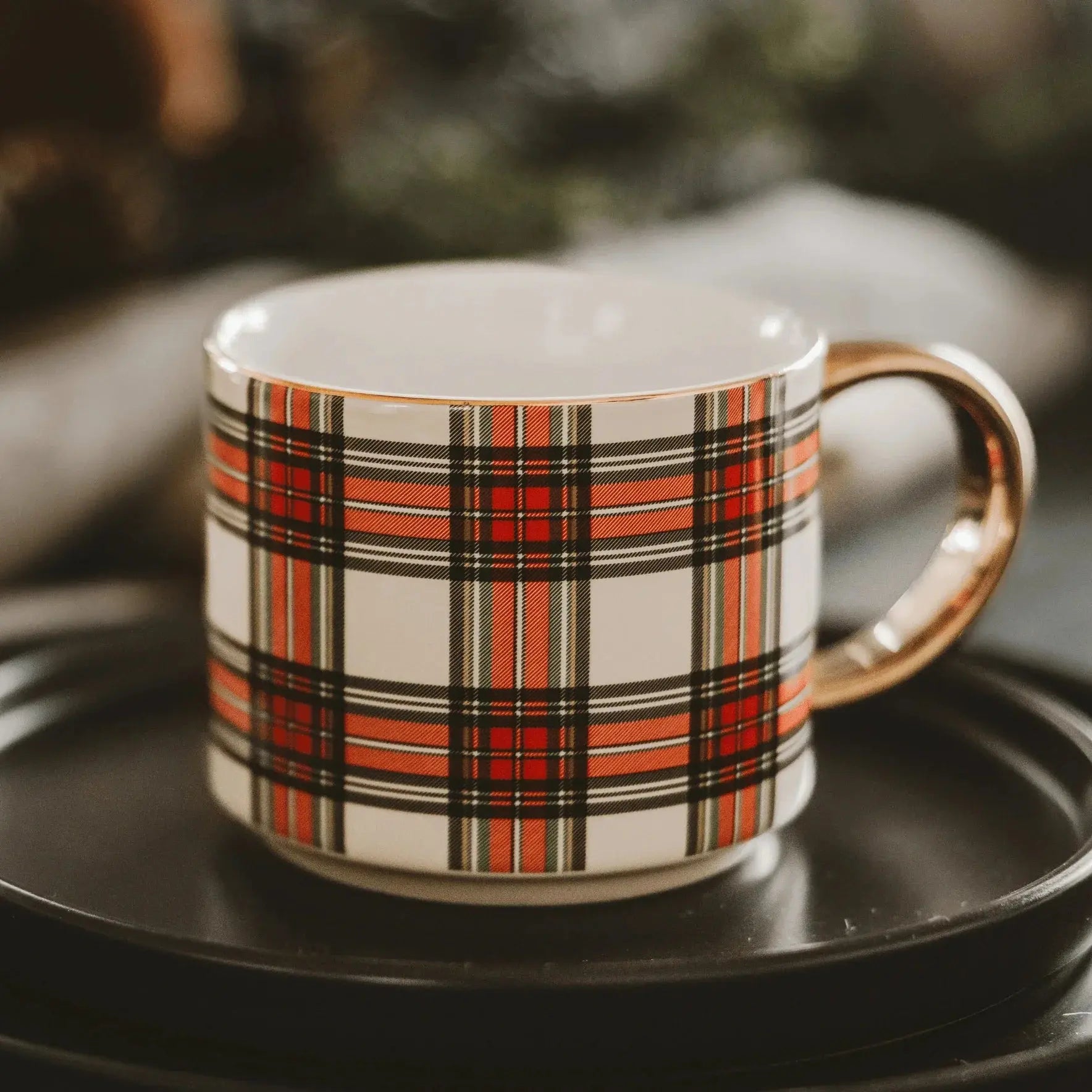 Red and black plaid coffee mug with gold handle, cozy farmhouse decor style