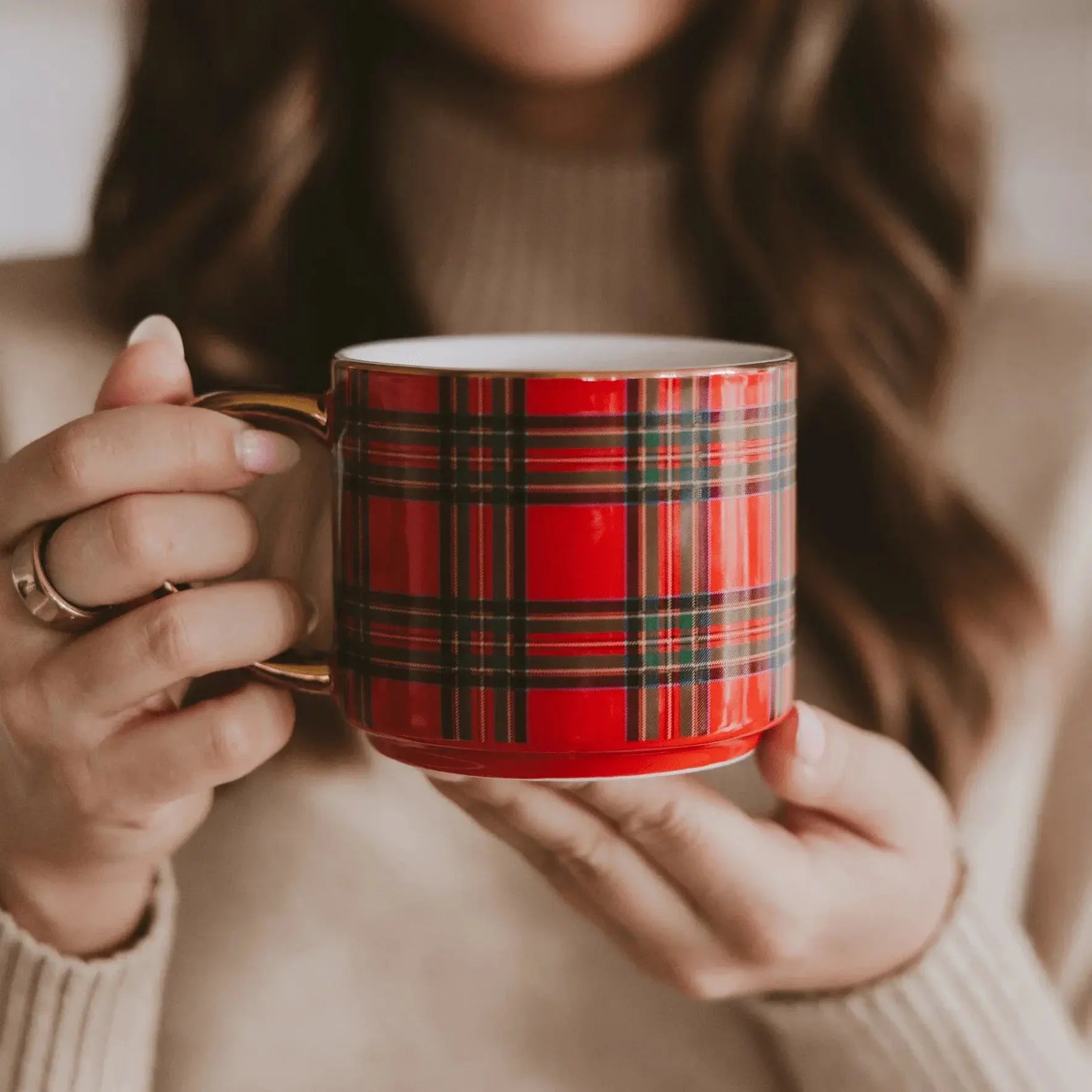 Red plaid mug with gold handle held by woman in cozy sweater, perfect for farmhouse or cottage decor