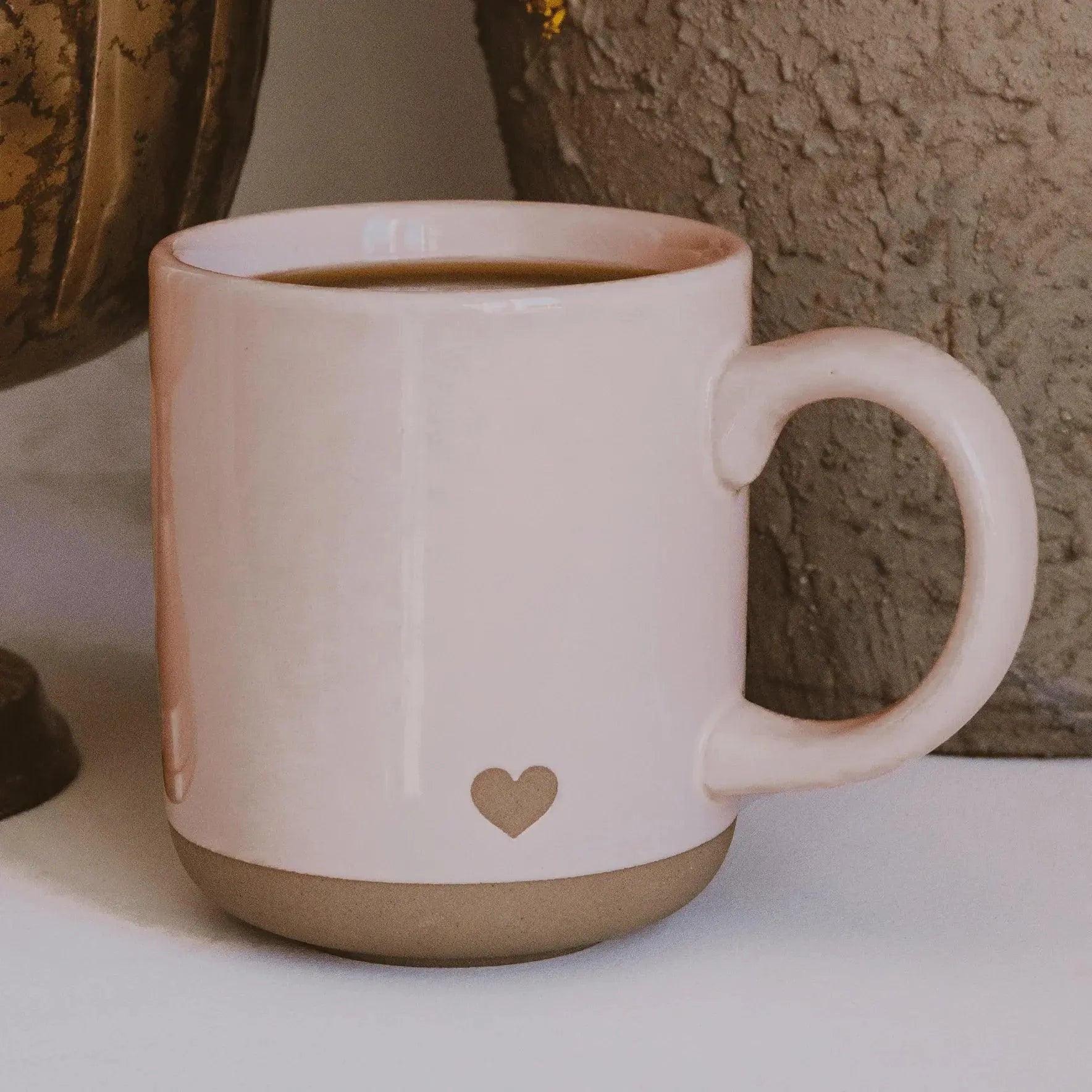 Pink ceramic mug with heart detail, cozy farmhouse style coffee cup for warm home decor
