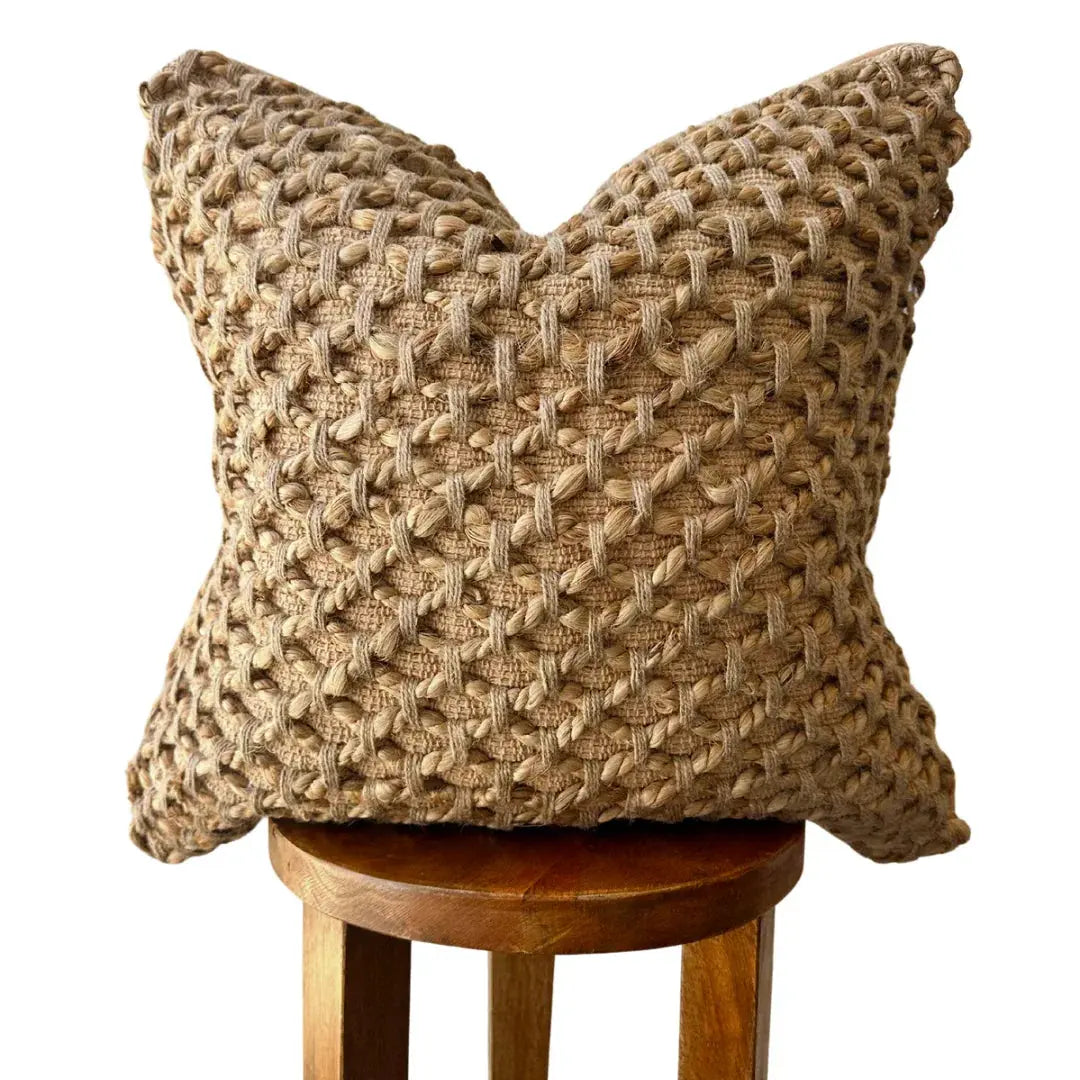 Textured woven throw pillow in neutral tones, perfect for farmhouse or cottage style decor