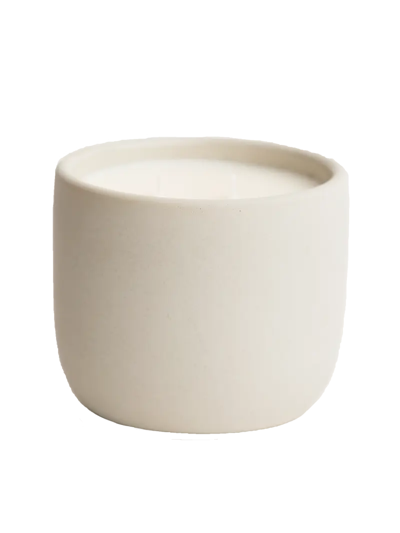 Beige cement candle on a white background