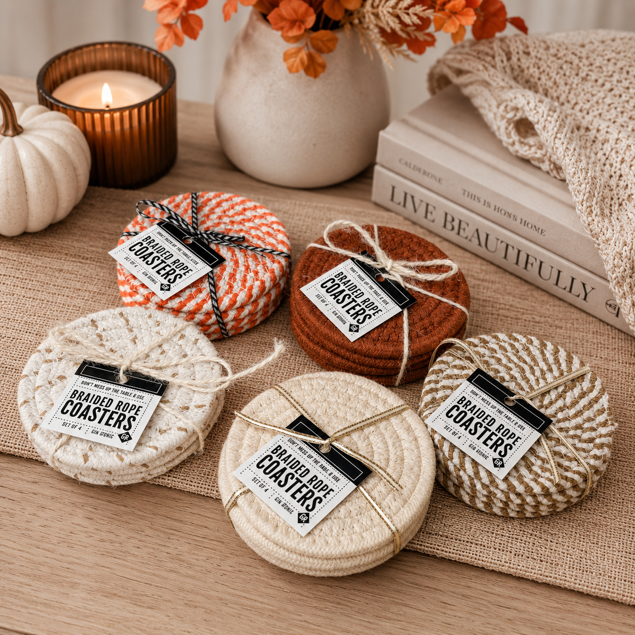 Set of round coasters with rope ties on a table with decorative items.