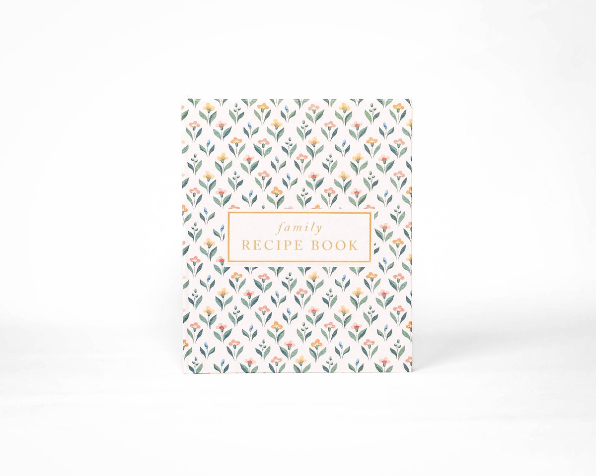 Floral patterned recipe book on a white background