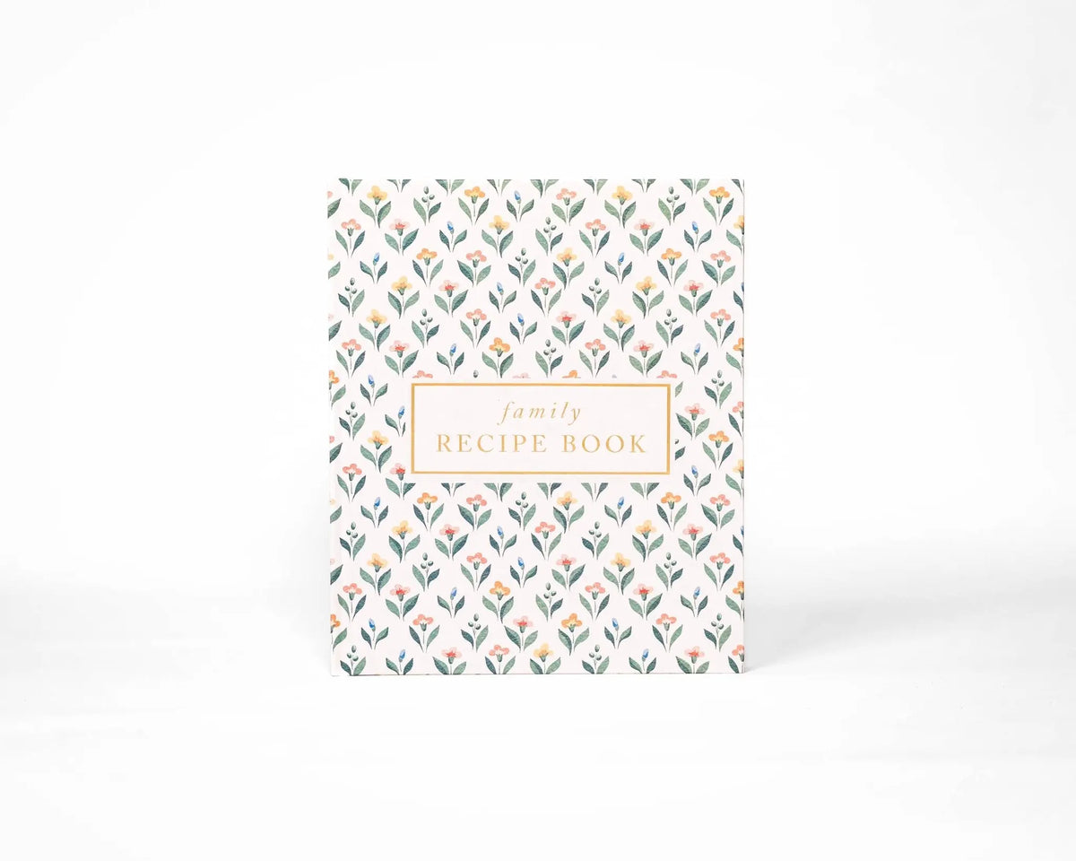 Floral patterned recipe book on a white background