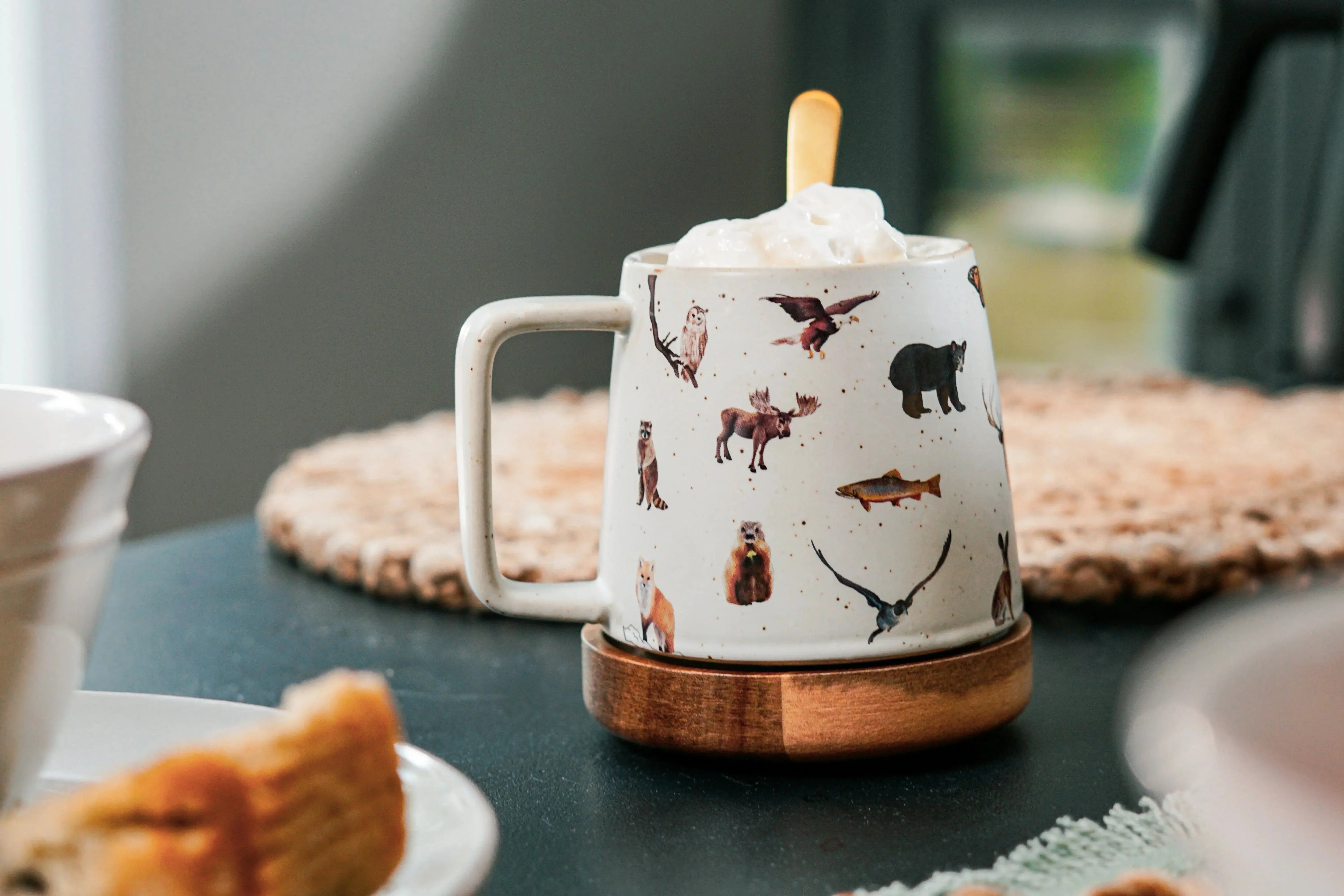 Cozy animal-print mug with whipped cream, perfect for farmhouse-style home decor and warm living spaces.