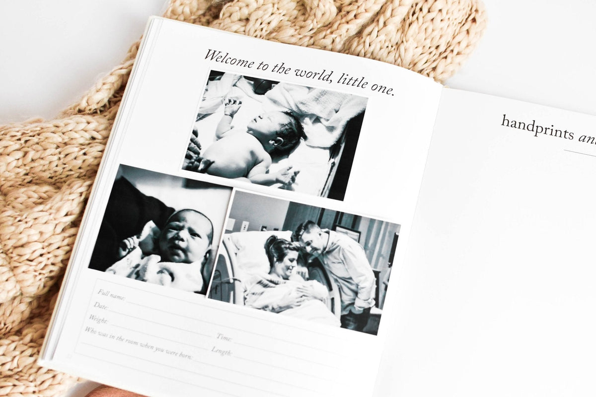 Book with baby photos and text on a textured surface
