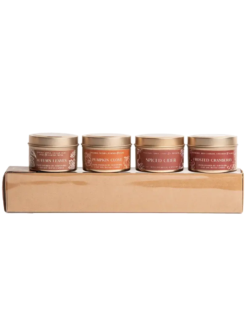 Set of four autumn-scented soy candles in gold tins: Autumn Leaves, Pumpkin Clove, Spiced Cider, Frosted Cranberry