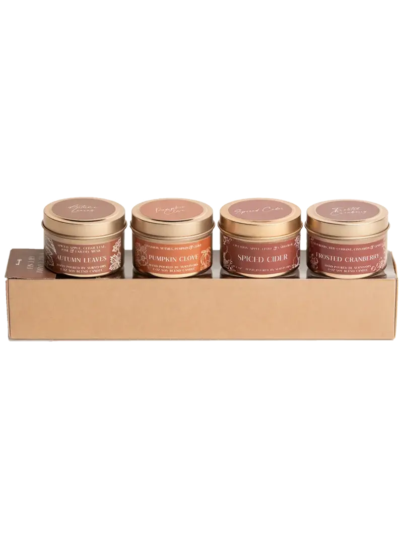 Set of four autumn-scented soy candles in gold tins: Autumn Leaves, Pumpkin Clove, Spiced Cider, Frosted Cranberry