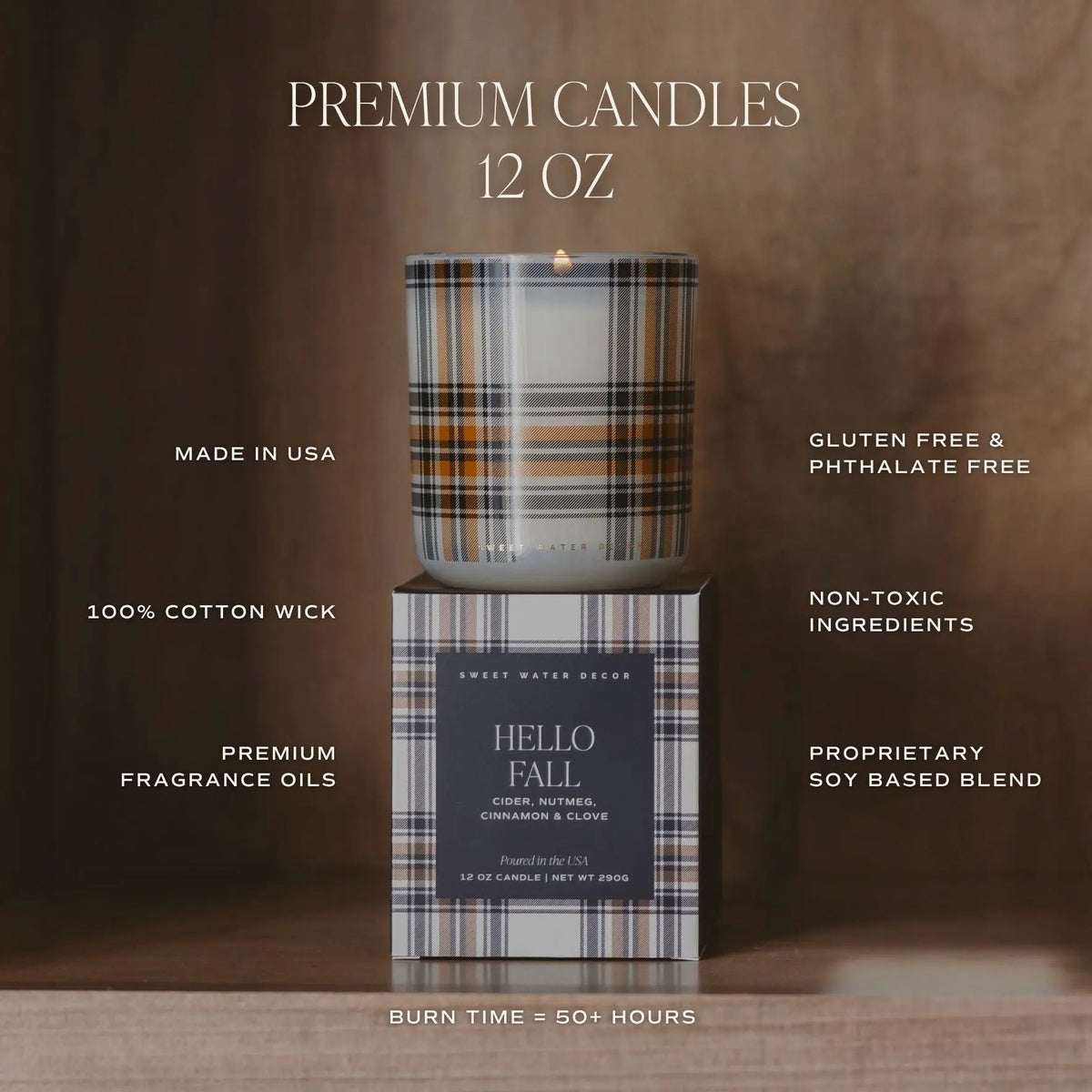 A premium soy candle in a plaid-patterned glass jar sits on top of its matching box against a dark brown background. White text around the product highlights features such as premium fragrance oils, 100% cotton wick, gluten free and phthalate free ingredients, made in USA, and 50+ hour burn time.