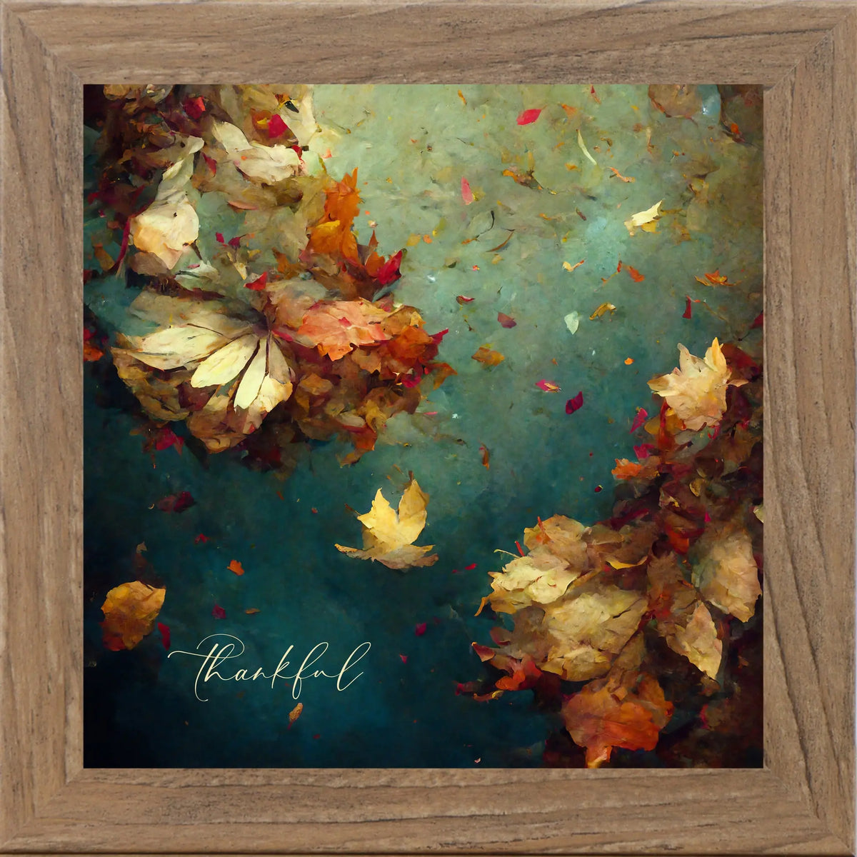 Framed artwork of autumn leaves with 'thankful' text on a teal background