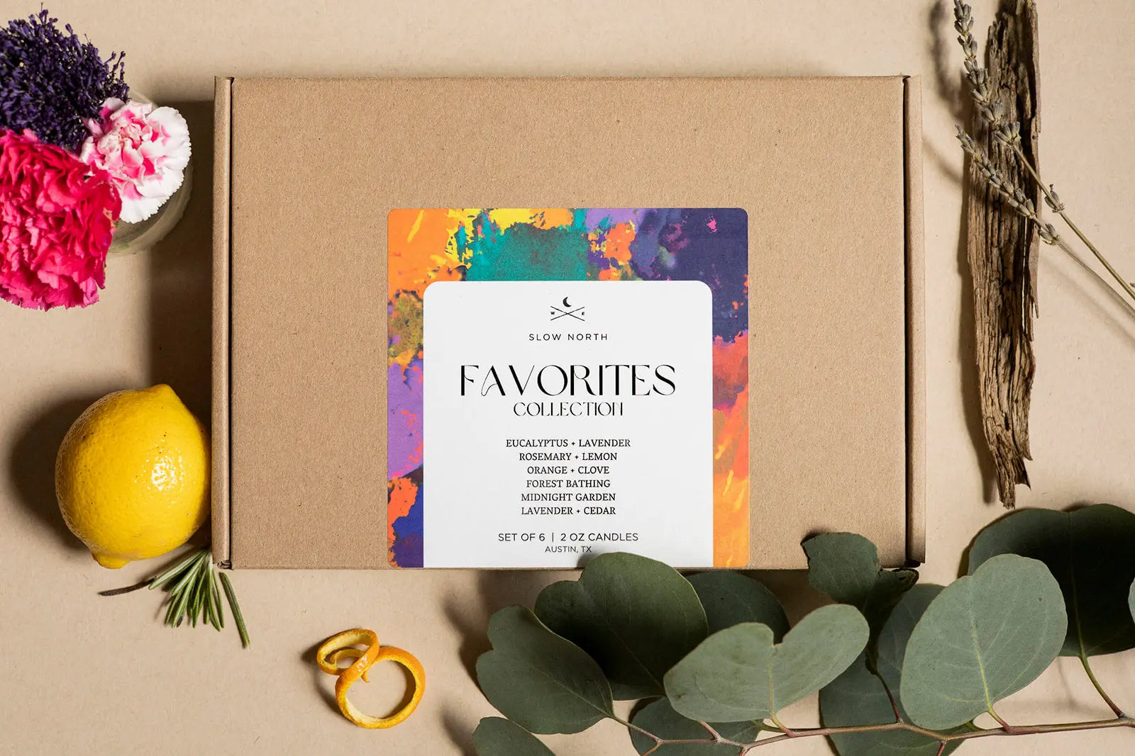 Slow North Favorites Collection set of 6 scented candles with eucalyptus, lavender, citrus, and forest notes, styled with dried florals and lemon
