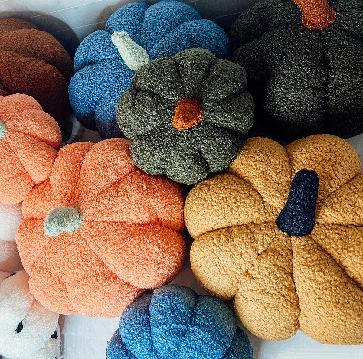 Collection of colorful textured pumpkins on a white background