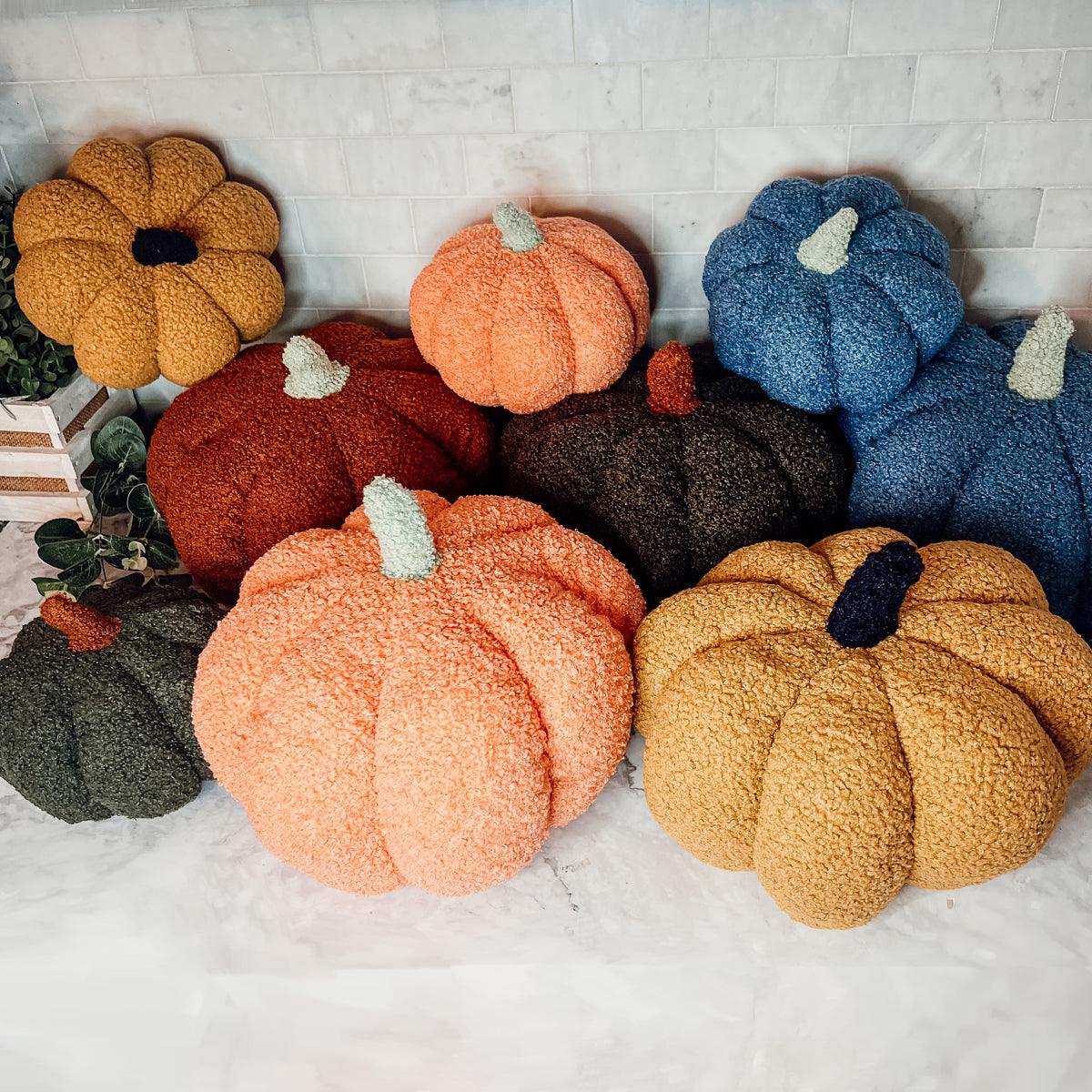Colorful pumpkins on a marble surface