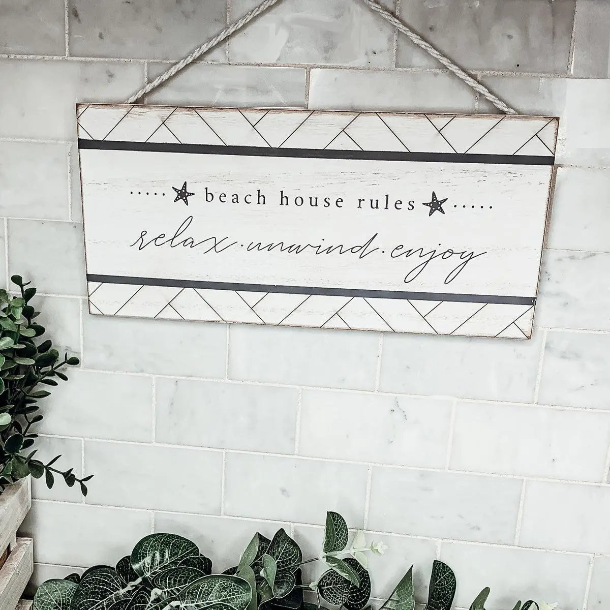 Beach house rules sign with relax unwind enjoy text, farmhouse decor on marble wall