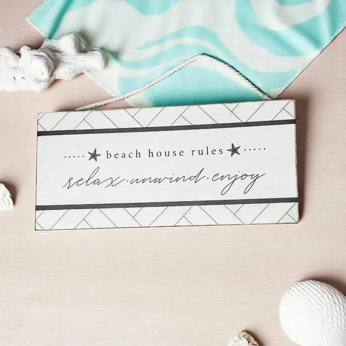 Beach house rules sign with relax unwind enjoy text, coastal decor with starfish and seashells