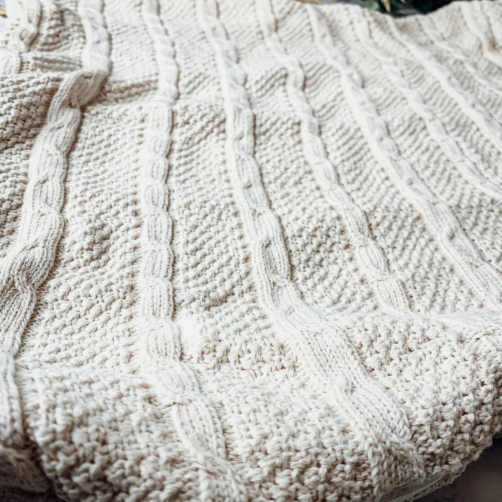 Cozy cream cable knit blanket for farmhouse and cottage style home decor