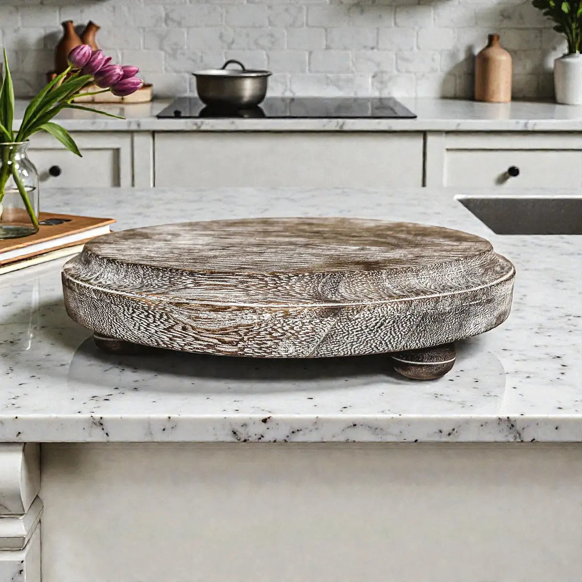 Decorative wooden turntable on a kitchen counter with a neutral color palette.