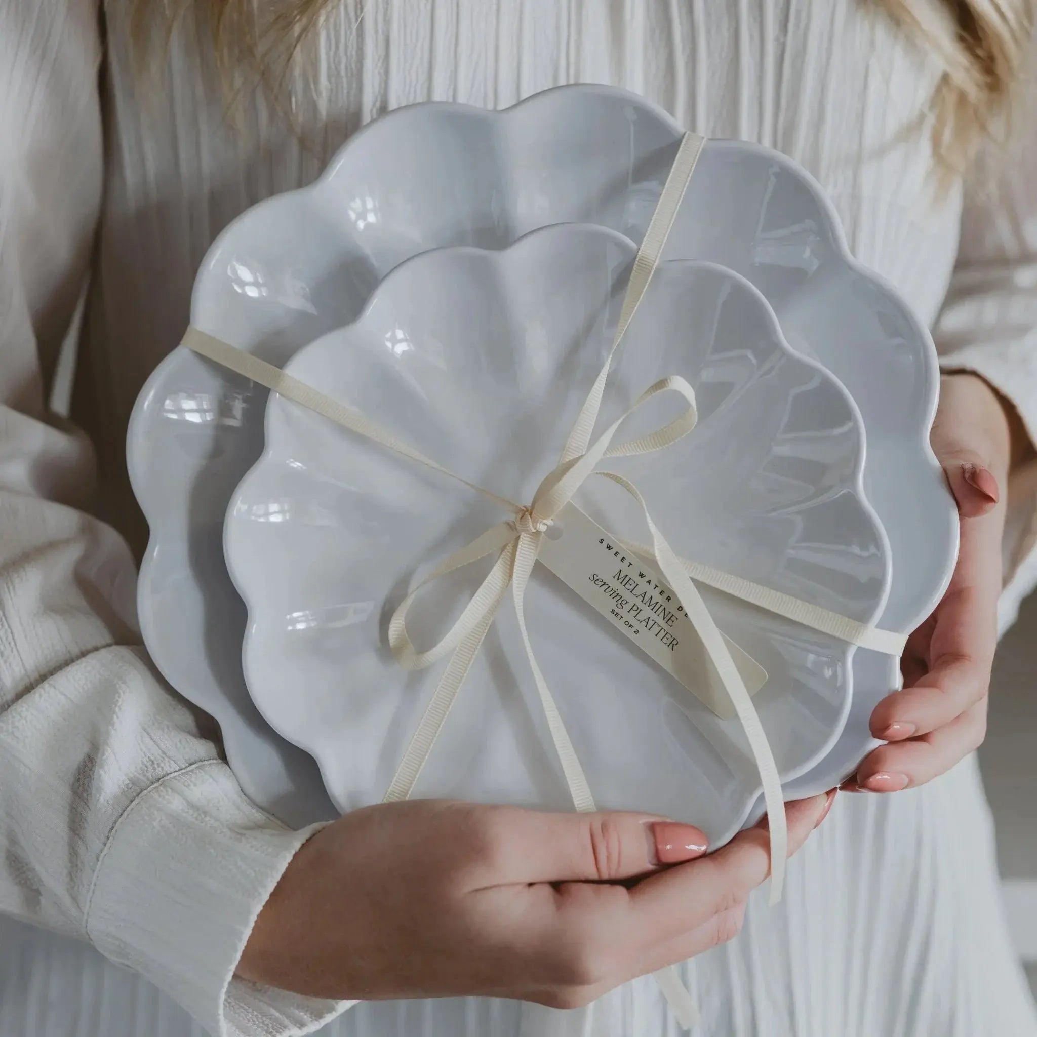 White scalloped melamine serving platters set of 2, tied with ribbon, cozy farmhouse home decor