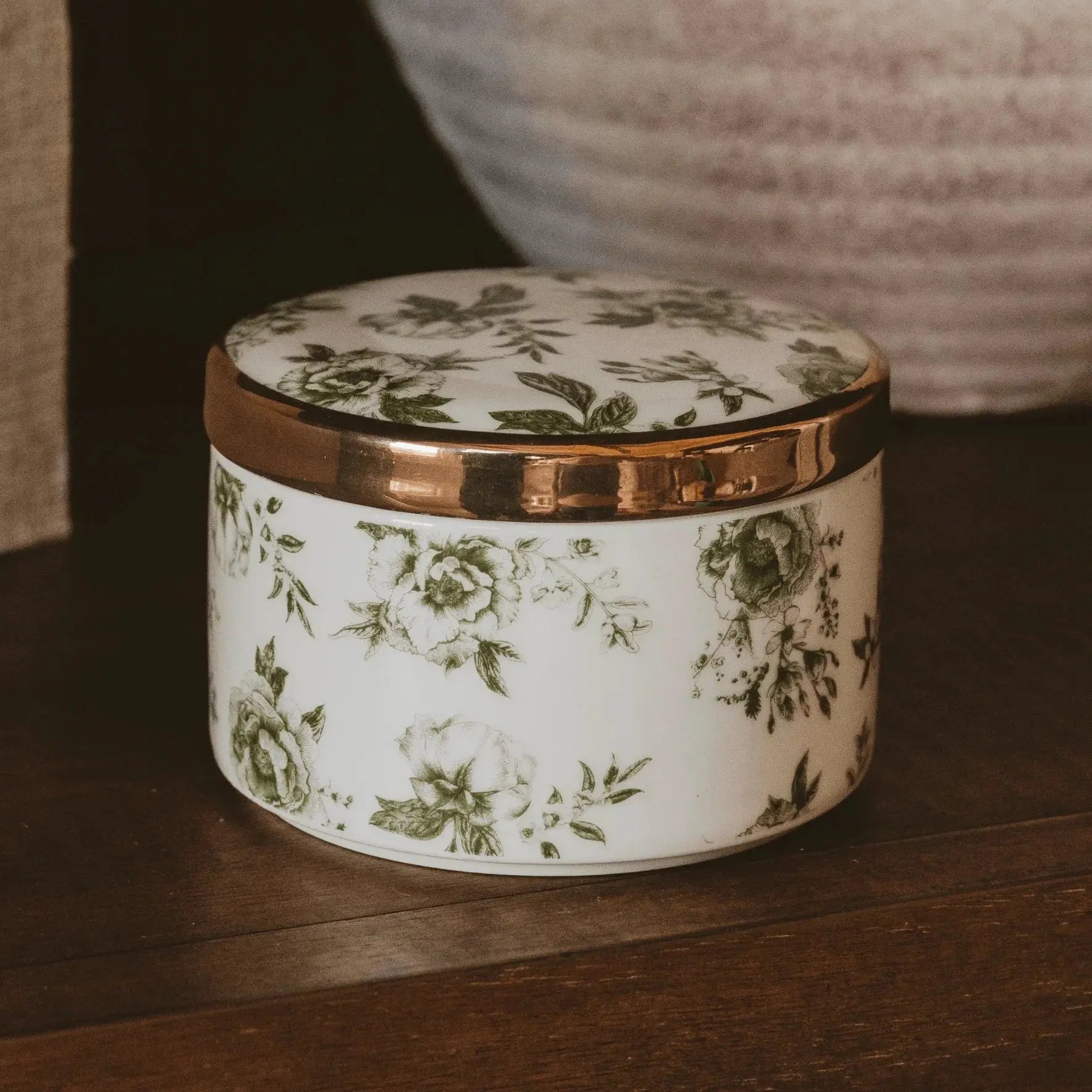 White ceramic box with green floral print and gold rim, farmhouse decor for cozy living spaces