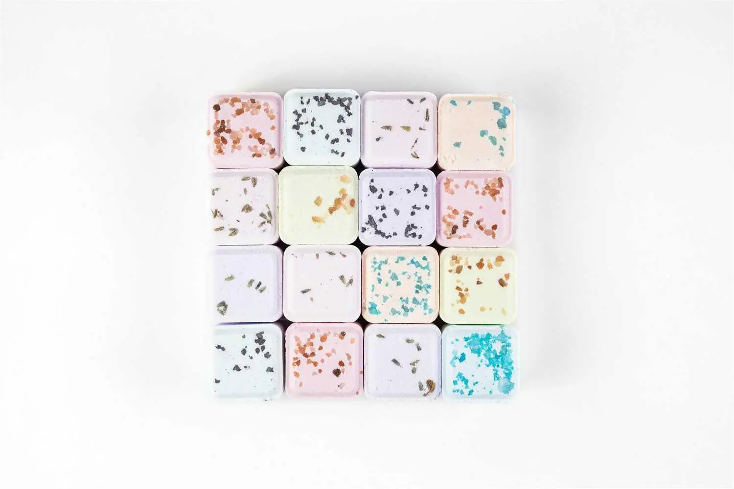 Pastel bath bombs with dried flowers and glitter, cozy farmhouse bath essentials
