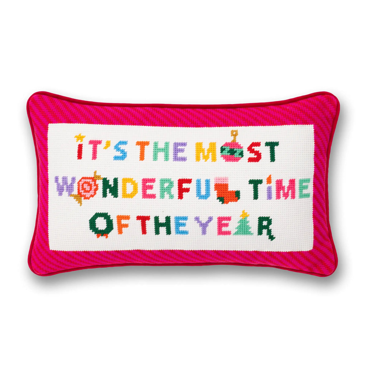 A rectangular cross-stitch cushion with a bright pink striped border and a white center panel featuring the embroidered text 'IT'S THE MOST WONDERFUL TIME OF THE YEAR' in multicolored letters.