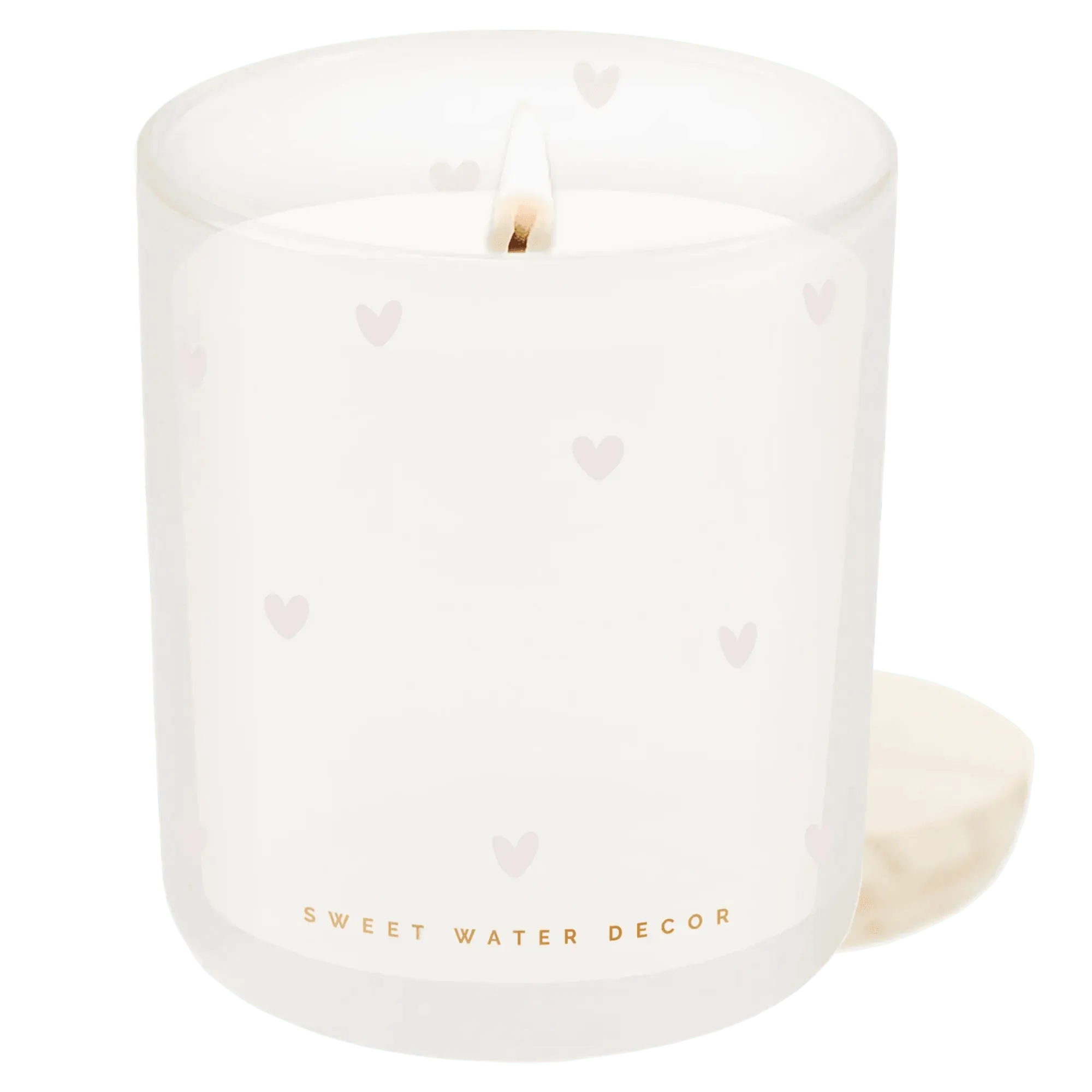 Frosted glass candle with pink hearts, lit flame, cozy home decor for farmhouse or cottage style spaces