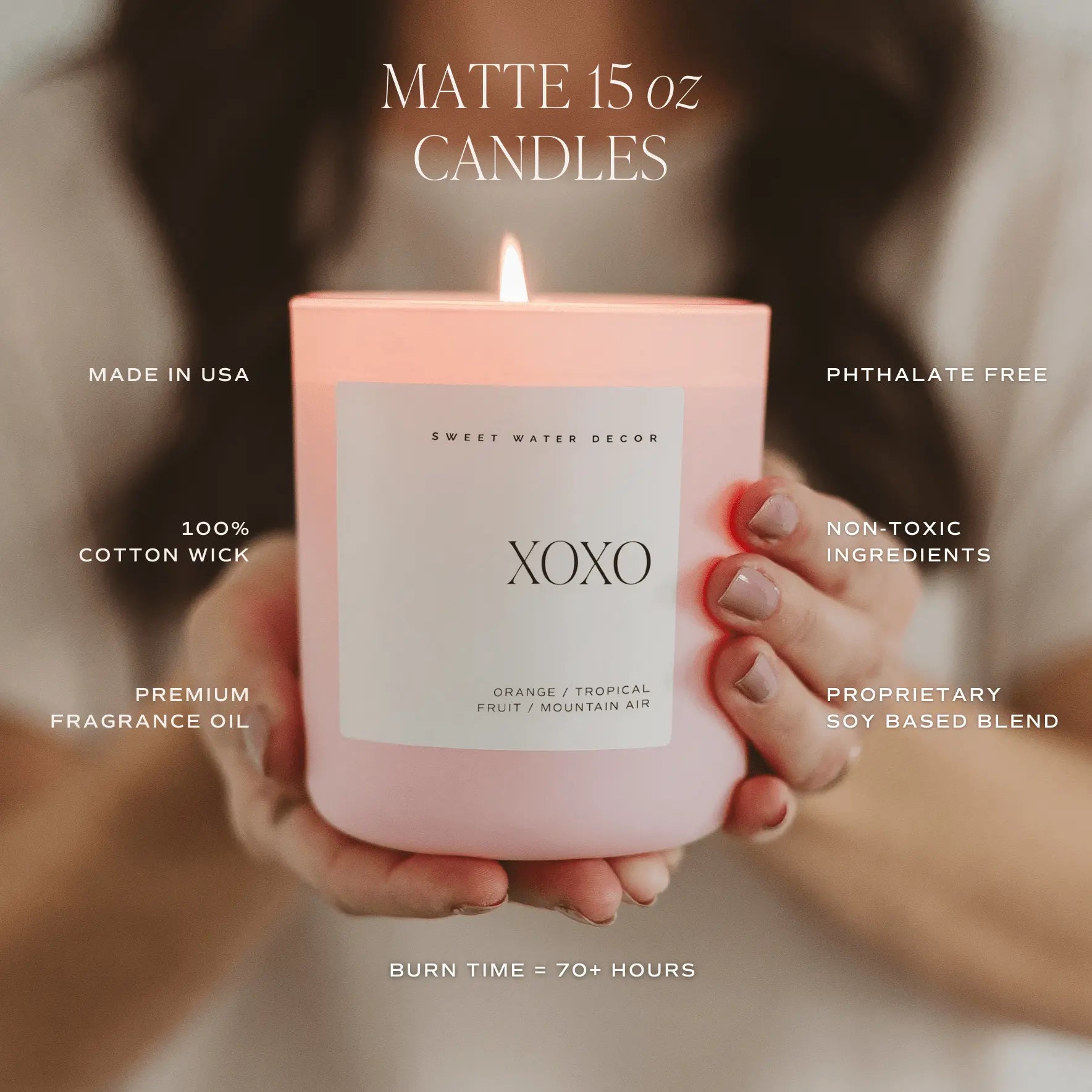 Pink candle labeled 'XOXO' held by hands with product details overlay
