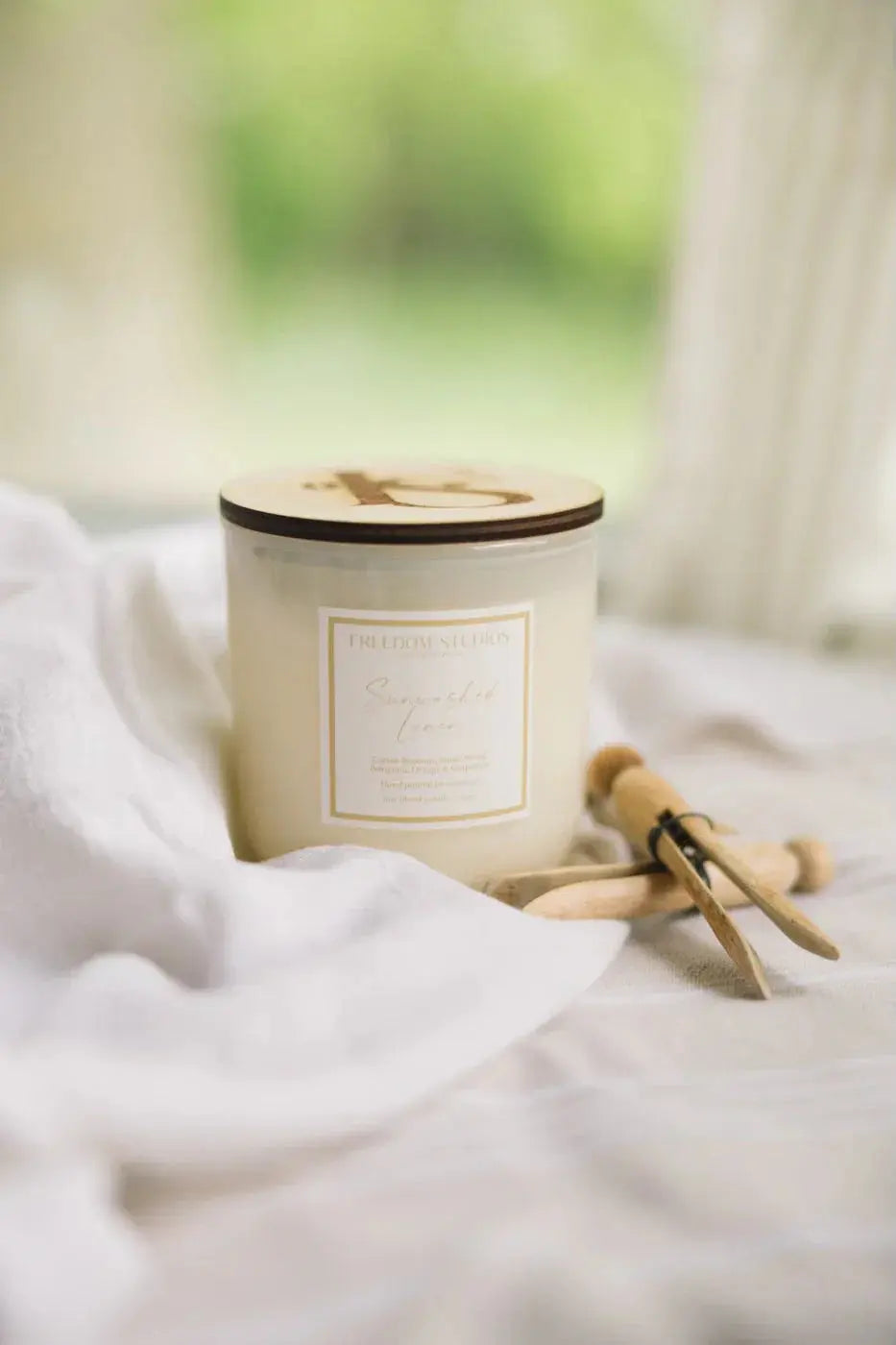 Sunwashed Linen scented candle in glass jar with wooden lid, cozy farmhouse decor with linen fabric and clothespins