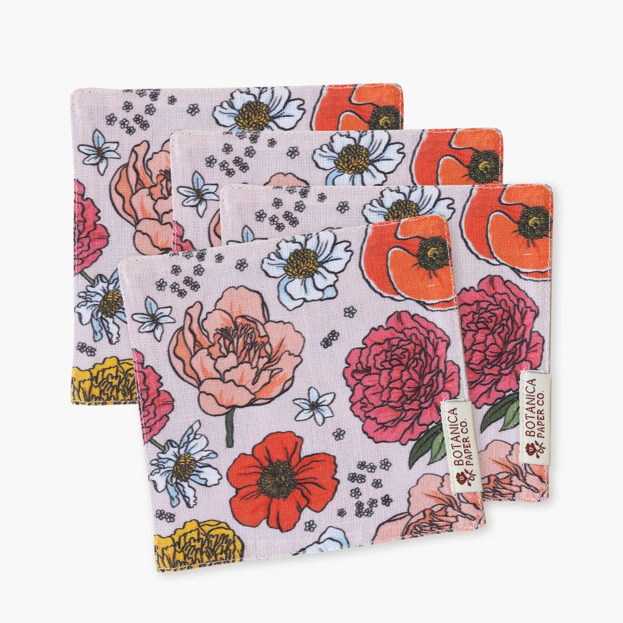 Set of floral-patterned napkins with Botanica Paper Co. branding on a white background
