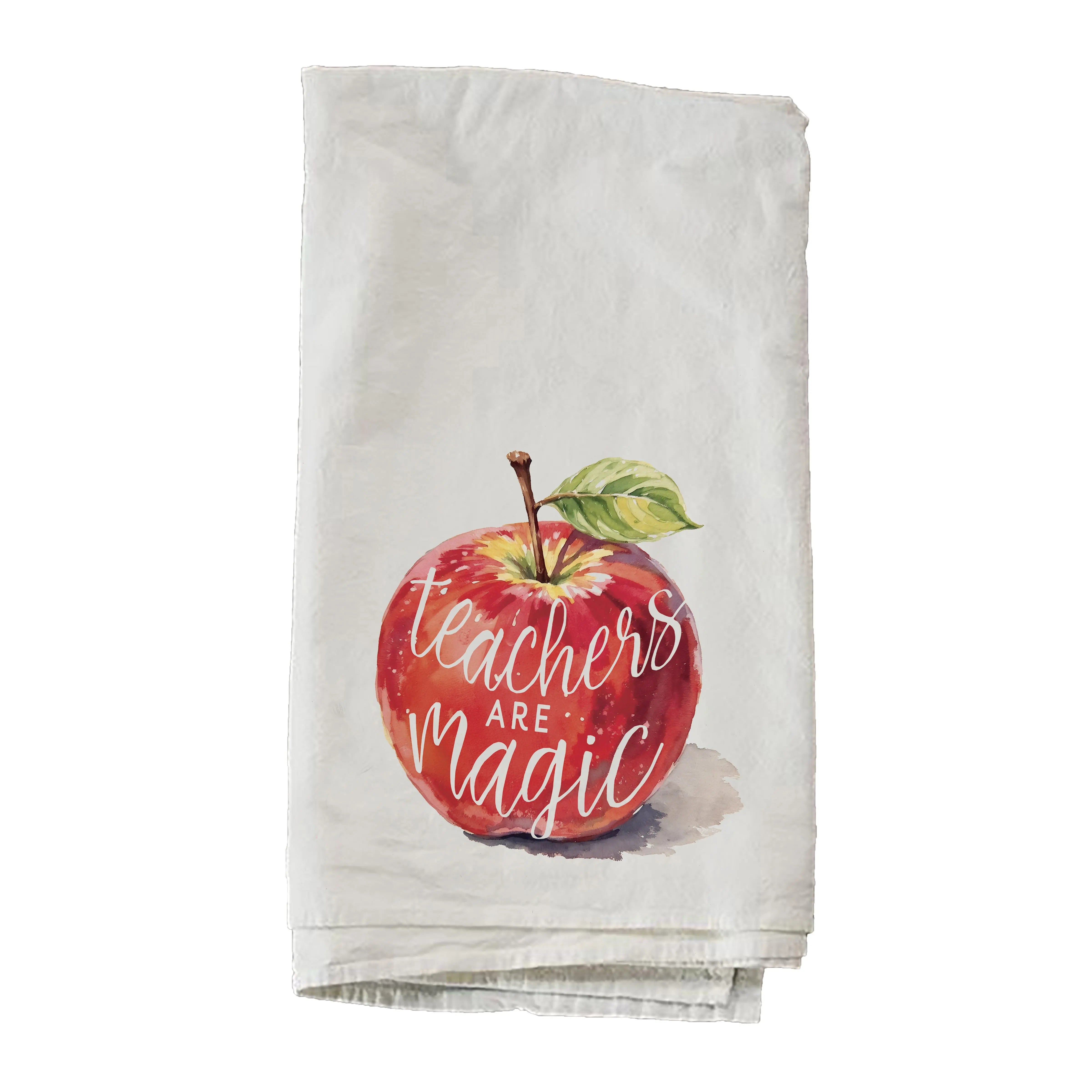 Folded towel with a red apple graphic and 'Teachers Are Magic' text on a white background