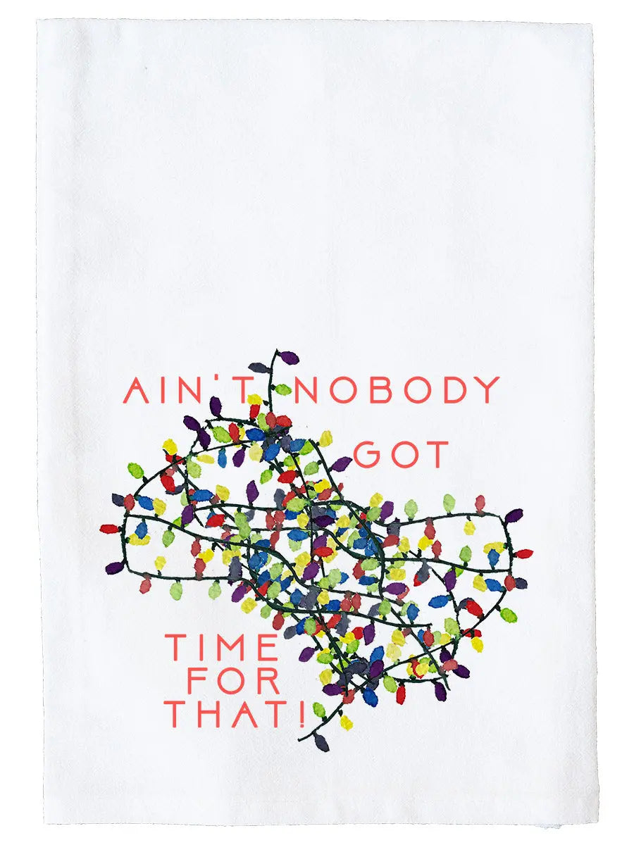 A white fabric tea towel featuring a festive holiday graphic with the text 'AIN'T NOBODY GOT TIME FOR THAT!' in coral red lettering surrounding a cluster of colorful Christmas string lights.