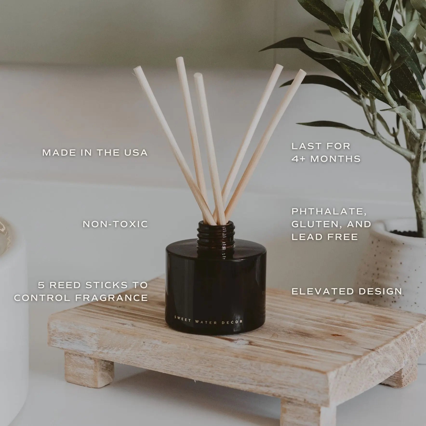 Black reed diffuser with wooden sticks on a wooden stand, featuring text about product features.