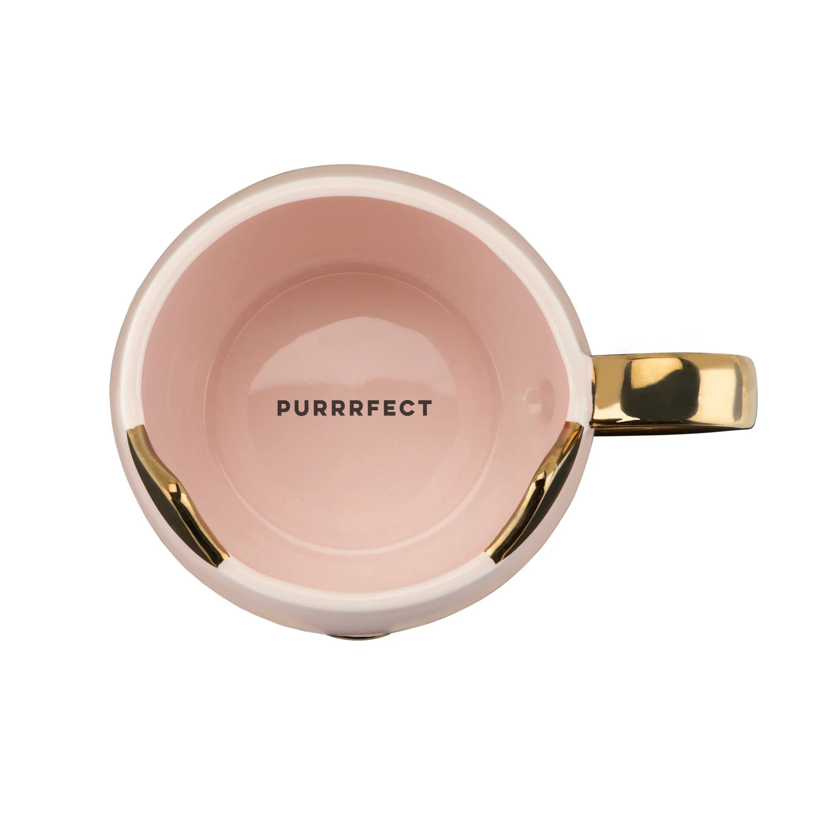 Pink mug with gold handle and 'PURRRFECT' text on a white background