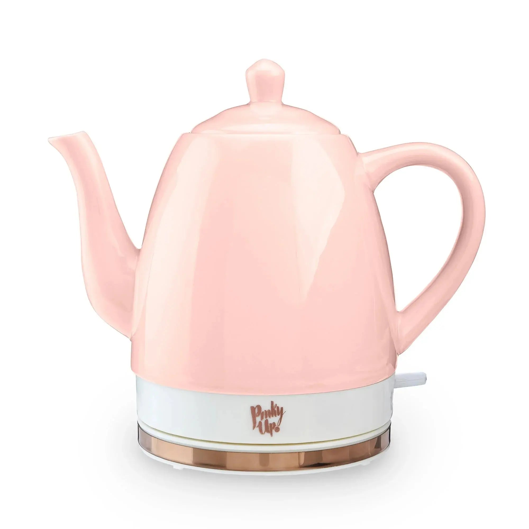 Pink electric kettle with a white base on a white background