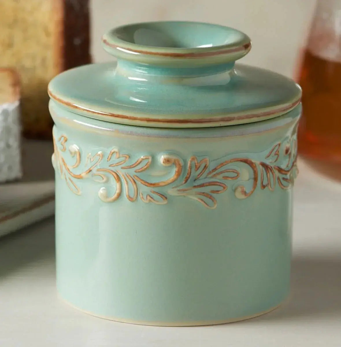 Mint green ceramic canister with embossed leaf design, farmhouse kitchen decor