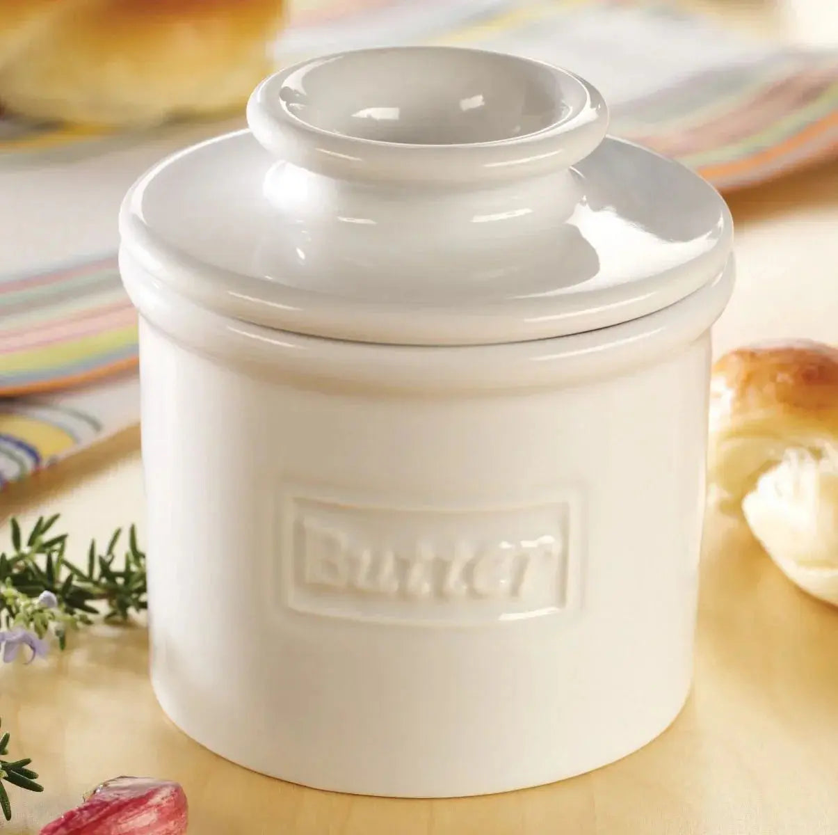 White ceramic butter crock with lid, farmhouse kitchen decor, embossed 'Butter' label, cozy cottage style