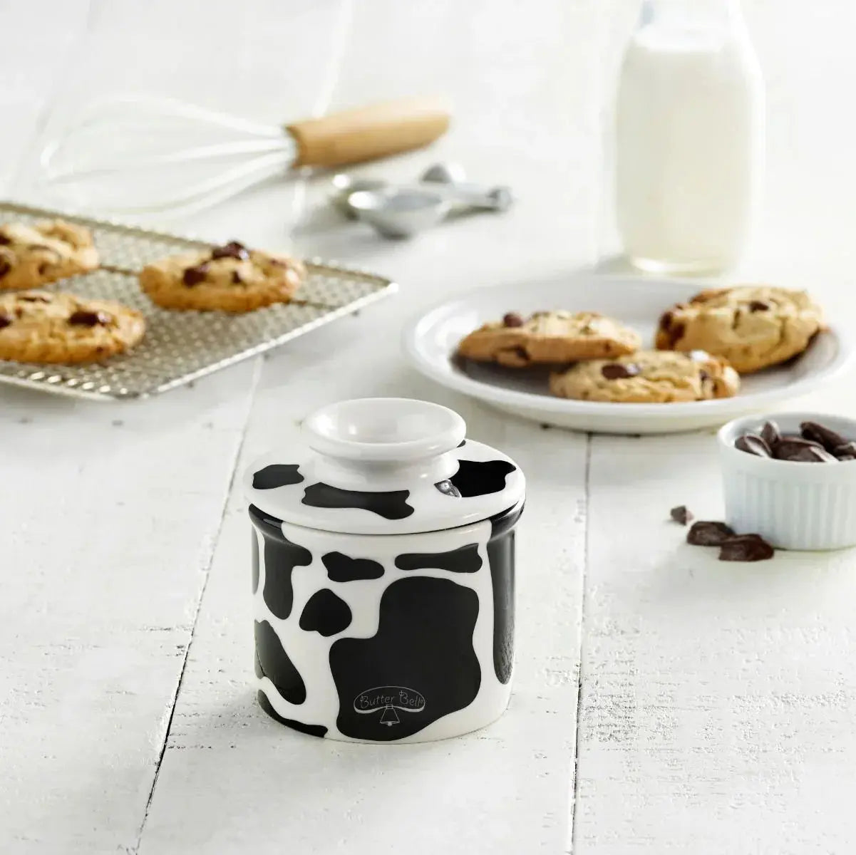 Cow print ceramic butter dish with fresh cookies and milk, farmhouse kitchen decor