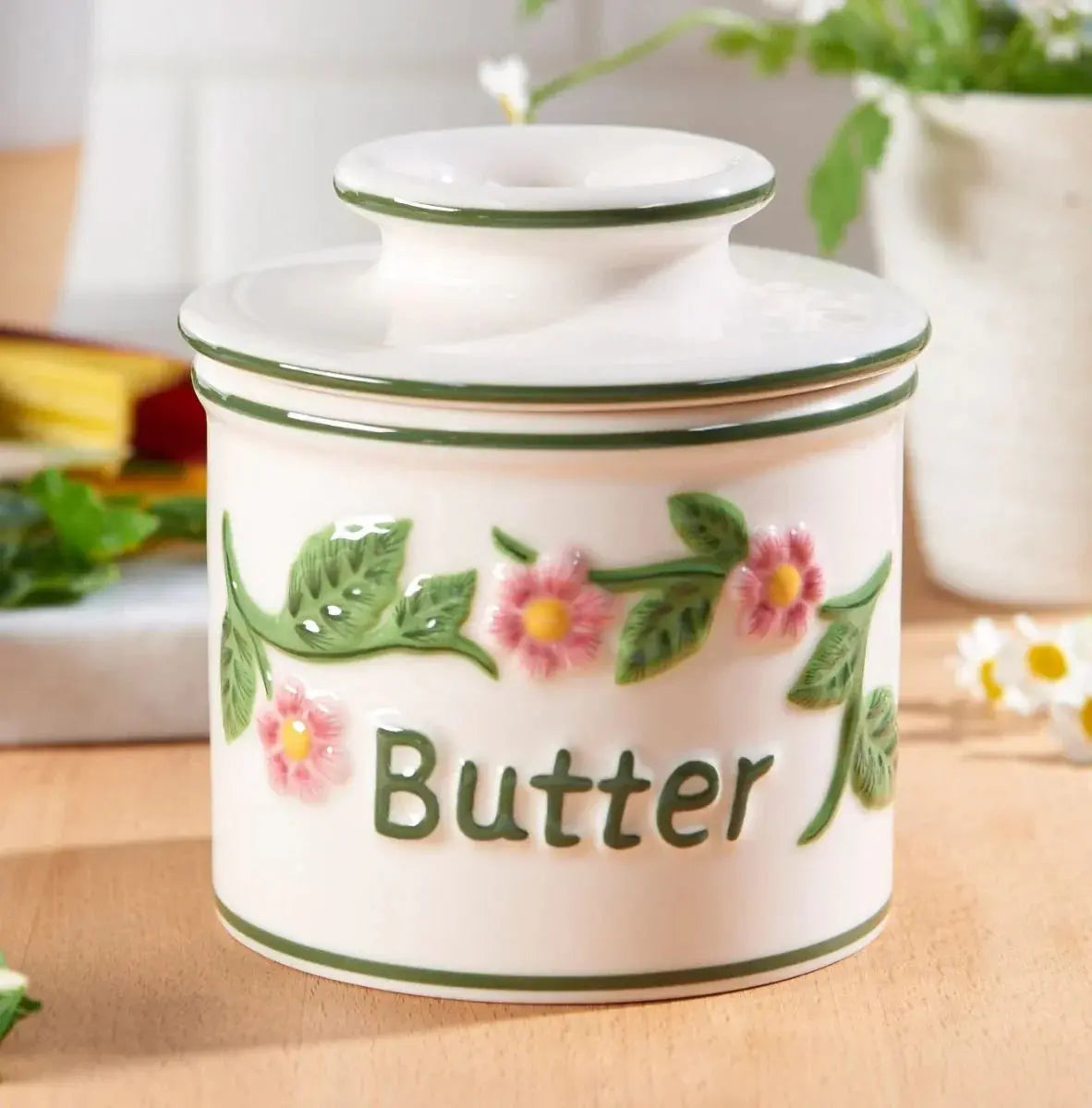 White ceramic butter crock with pink flowers and green leaves, farmhouse kitchen decor