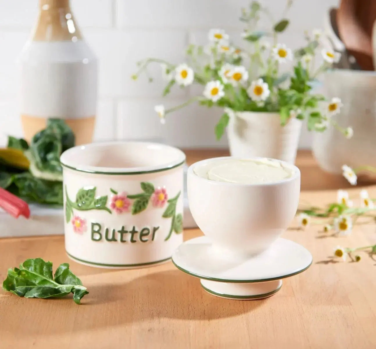 Ceramic butter dish with floral design, perfect for farmhouse kitchen decor and cozy cottage style homes.