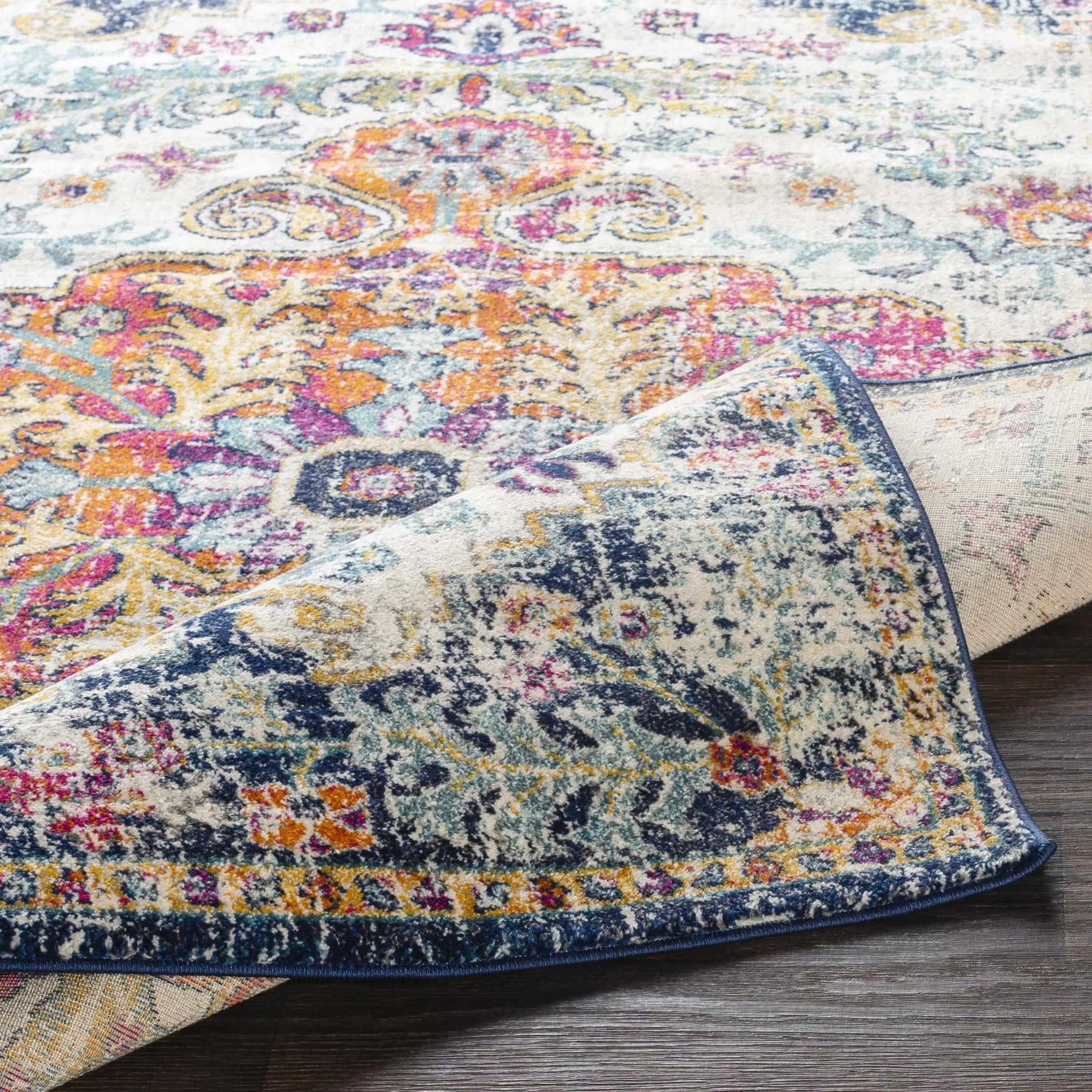 Colorful vintage-style area rug with floral paisley pattern, perfect for cozy farmhouse or cottage decor.